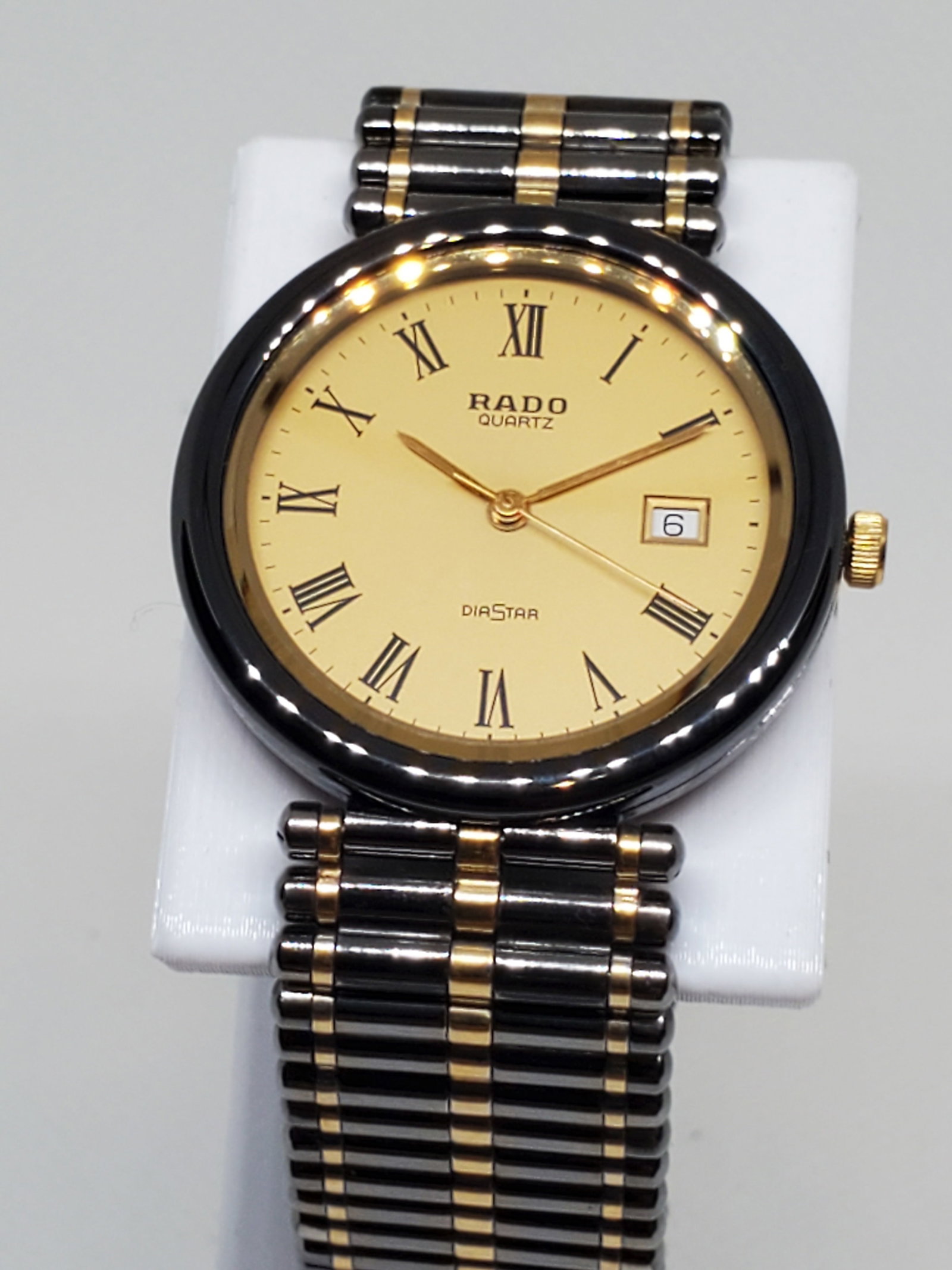Rado DiaStar Gunmetal and Gold Watch, 1990s - Vintage Collection -: Rado DiaStar 129.9532.3 in operating condition, a watch that perfectly embodies elegance, prestige, and durability. This stunning timepiece features Rado?s signature scratch-proof case, ensuring lasti