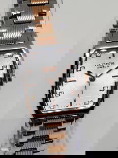 Gruen Dual Tone Rose Gold-Silver with Crystals Tank Watch, 2000s - Vintage Collection -: Discover the timeless elegance and luxury of the Gruen GLS128 -working- a refined timepiece that radiates sophistication with its exquisite rose gold and silver tones. The contrast between the rose go