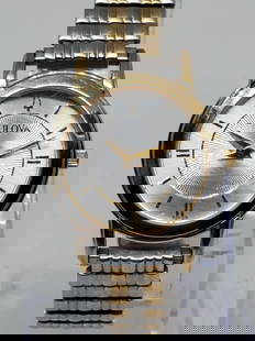 Bulova Gold Plated ladies Watch, 1997          -vintgae collection-: Elevate your wristwear with the Bulova C976836, a refined dress watch that blends elegance and practicality. This quartz timepiece features a silver-tone rectangular case accented by a gold-plated bez