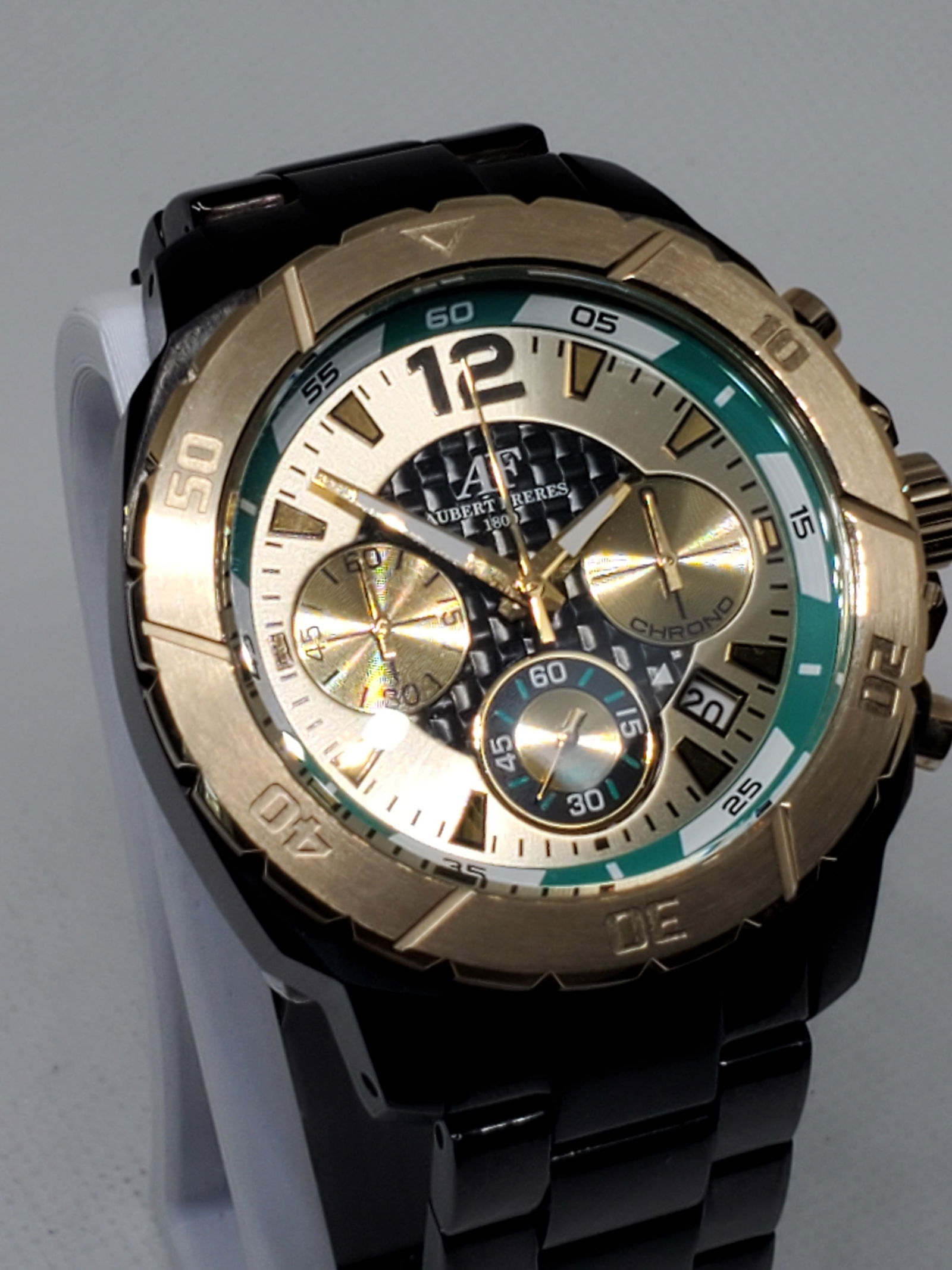 Aubert Freres Crhronograph 14180 Watch, 2000s: Working condition Aubert Freres 14180, a perfect blend of sophistication and functionality tailored for the modern enthusiast. This striking sports watch features a sleek black case paired with a gold