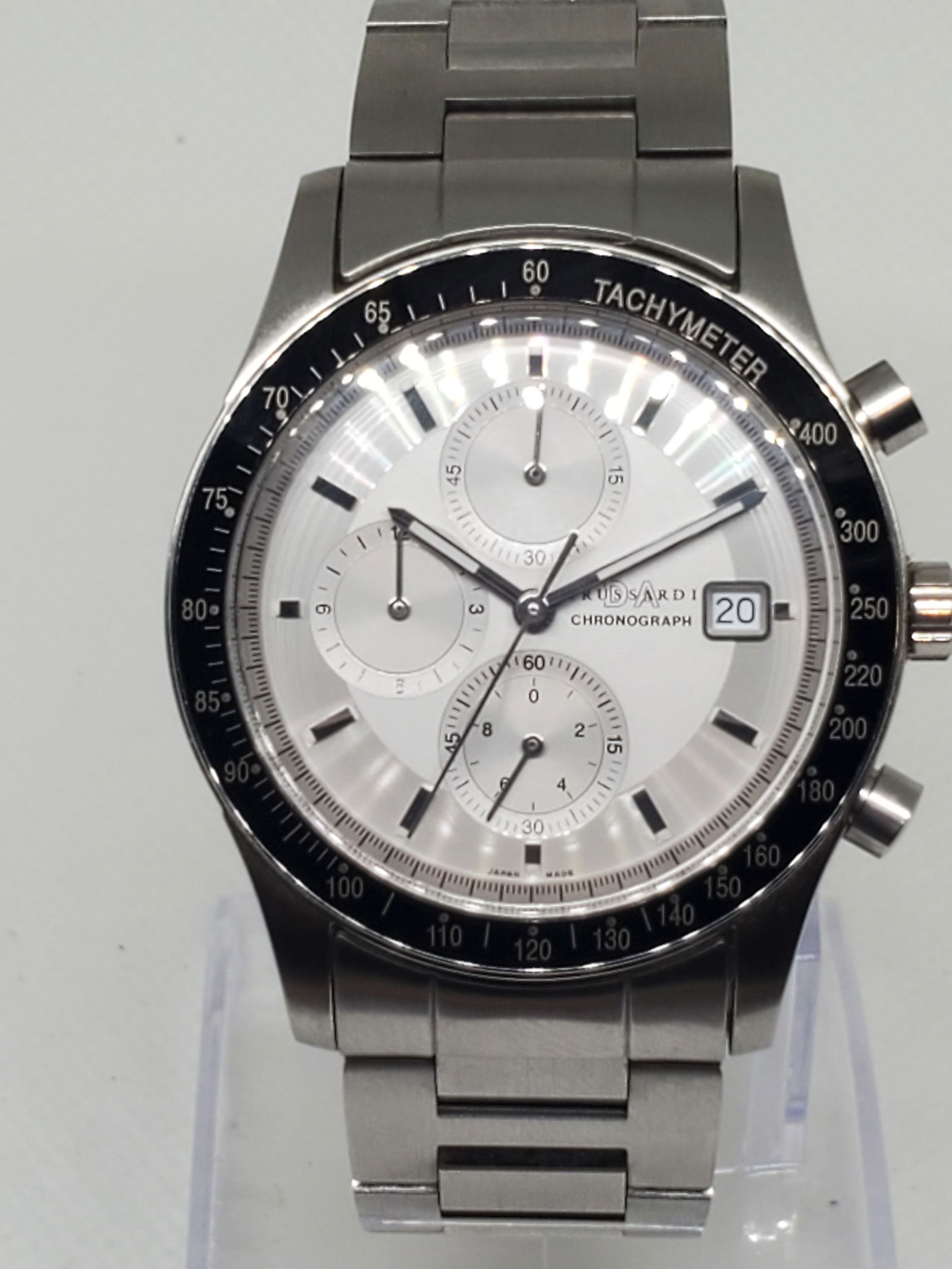 Trussardi Chronograph TRD-2005 Watch, 2010s: The Trussardi TRD-2005 9890 blends Italian flair with sporty functionality in a refined, modern design. Featuring a 37mm (1.44”) silver-tone case with a bold black bezel, this quartz-powered wat