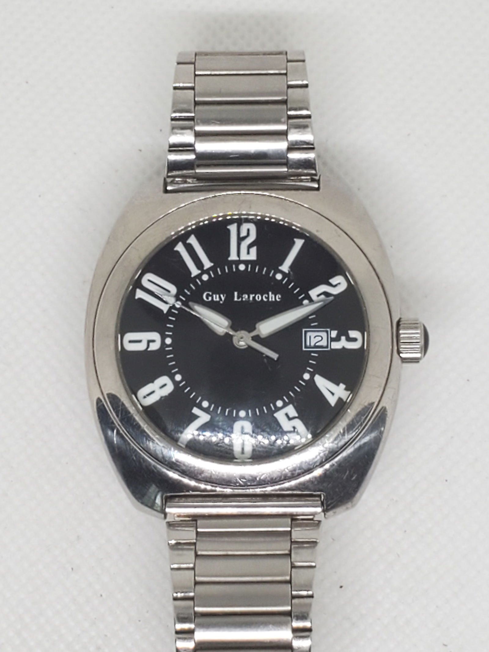 Guy Laroche Paris Quartz Watch Black Dial Date Window Stainless Steel 42mm, 1990s: This elegant Guy Laroche Paris mens quartz watch embodies the refined style and precision expected from the legendary French fashion house. The watch features a bold black dial with large white Arabic