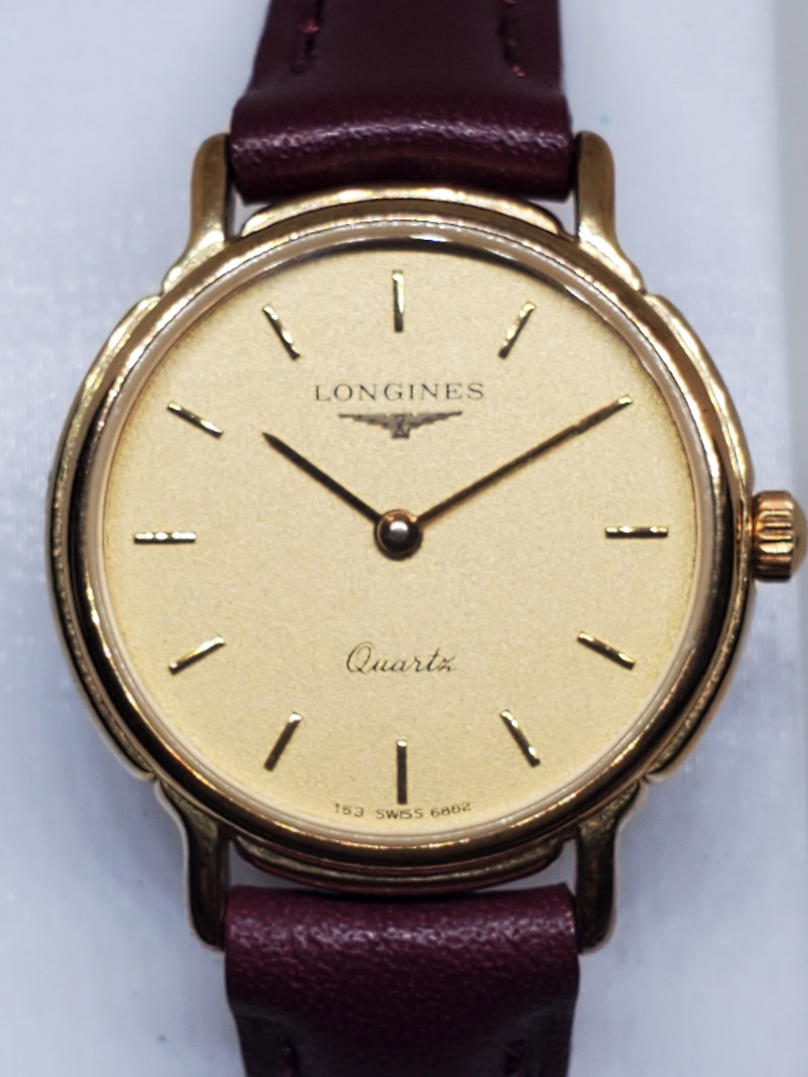Vintage Longines 153 Quartz Gold Plated Dress Watch ? Swiss Elegance, late 1980s to early 1990s: This exquisite Longines 153 Quartz watch showcases the brand?s timeless commitment to precision and refinement. Featuring a gold plated case with a matching gold tone dial, the watch radiates understa