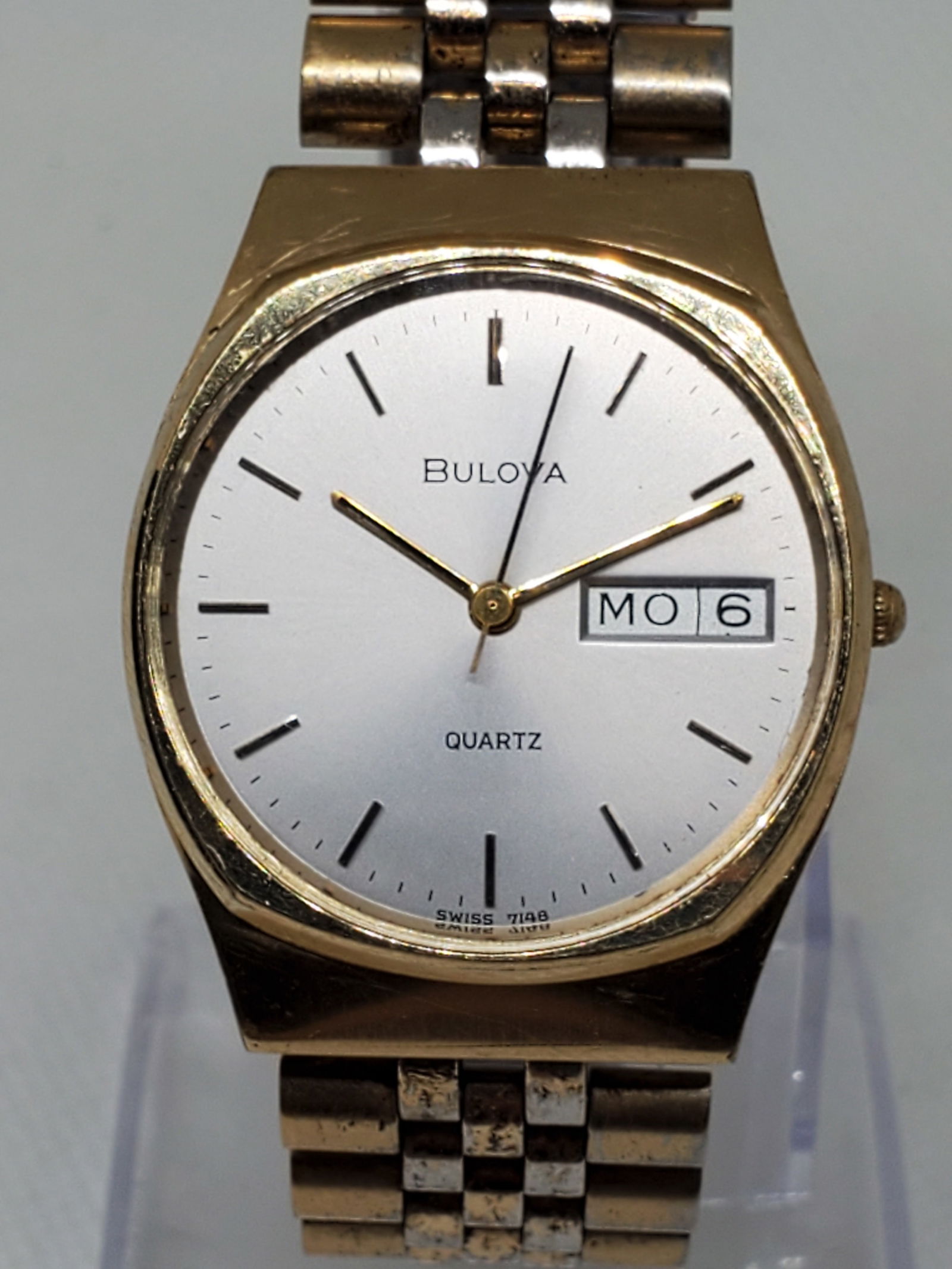 Bulova Gold Plated Mens Watch, 1980s: Elevate your collection with this elegant Bulova P0 dress watch, a fine example of classic design and everyday functionality. Featuring a gold plated case and a refined silver dial with minimalist sti