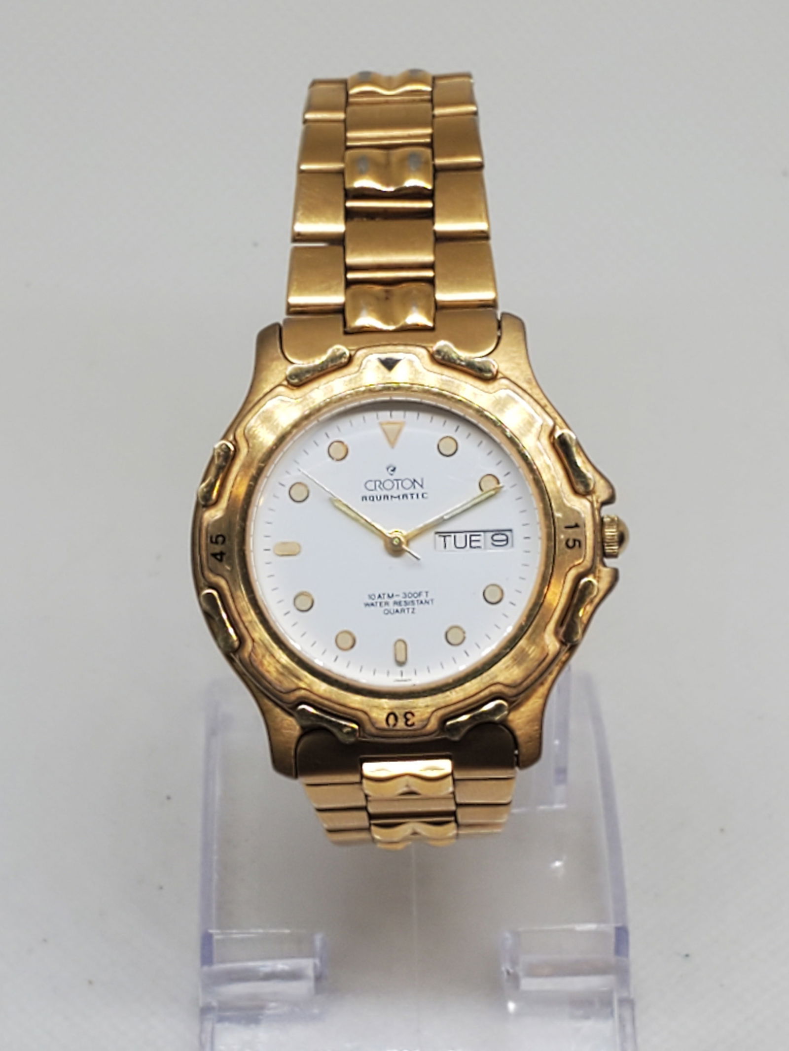 Croton Aquamatic Gold Plated Men's Watch, 1990s: Discover reliable style with the Croton Aquamatic, a quartz powered timepiece that blends everyday utility with gold tone elegance running . Featuring a 36mm (1.4?) gold plated case, this watch showca