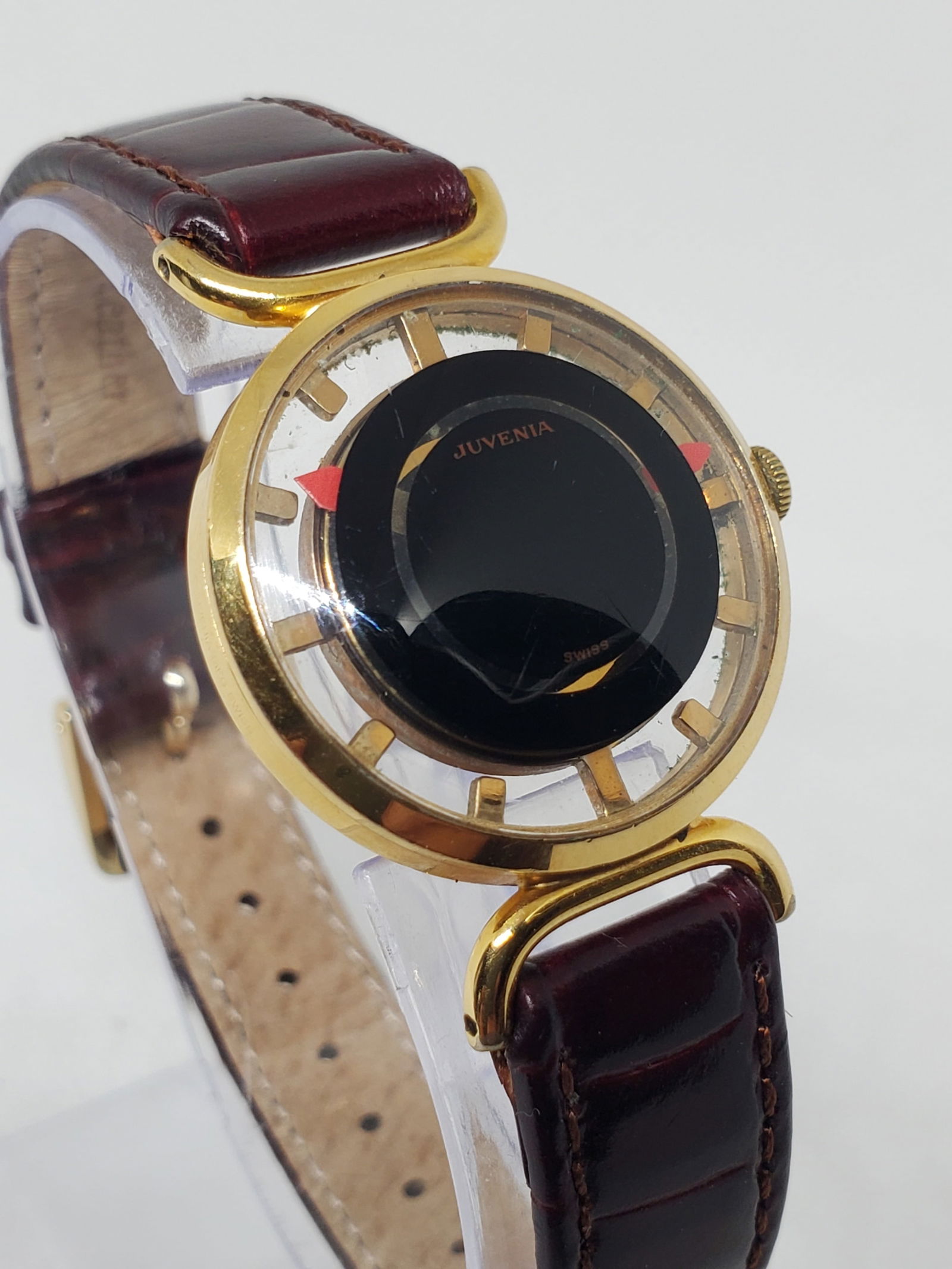 Juvenia Mystere Skeleton Manual Gold Plated Swiss Dress Watch 28mm, 1960s: This elegant Juvenia Mystere dress watch exemplifies refined Swiss watchmaking with a distinctive Mystere dial that creates a floating hand effect, paired with a tasteful skeleton back revealing the m