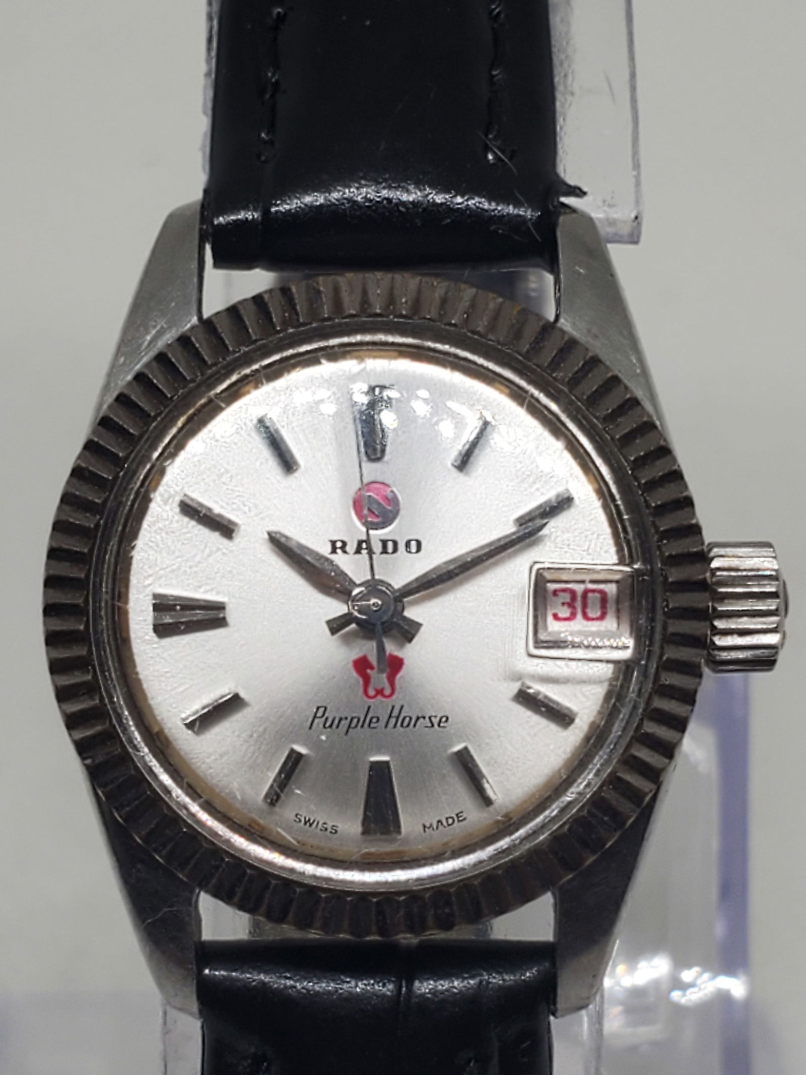 Vintage Rado Purple Horse Automatic Ladies Watch Silver Dial Swiss Made, circa 1965 to 1975: This elegant vintage Rado Purple Horse embodies the timeless prestige of Swiss horology. Crafted with a silver tone stainless steel case and a refined silver dial with date display, this ladies automa