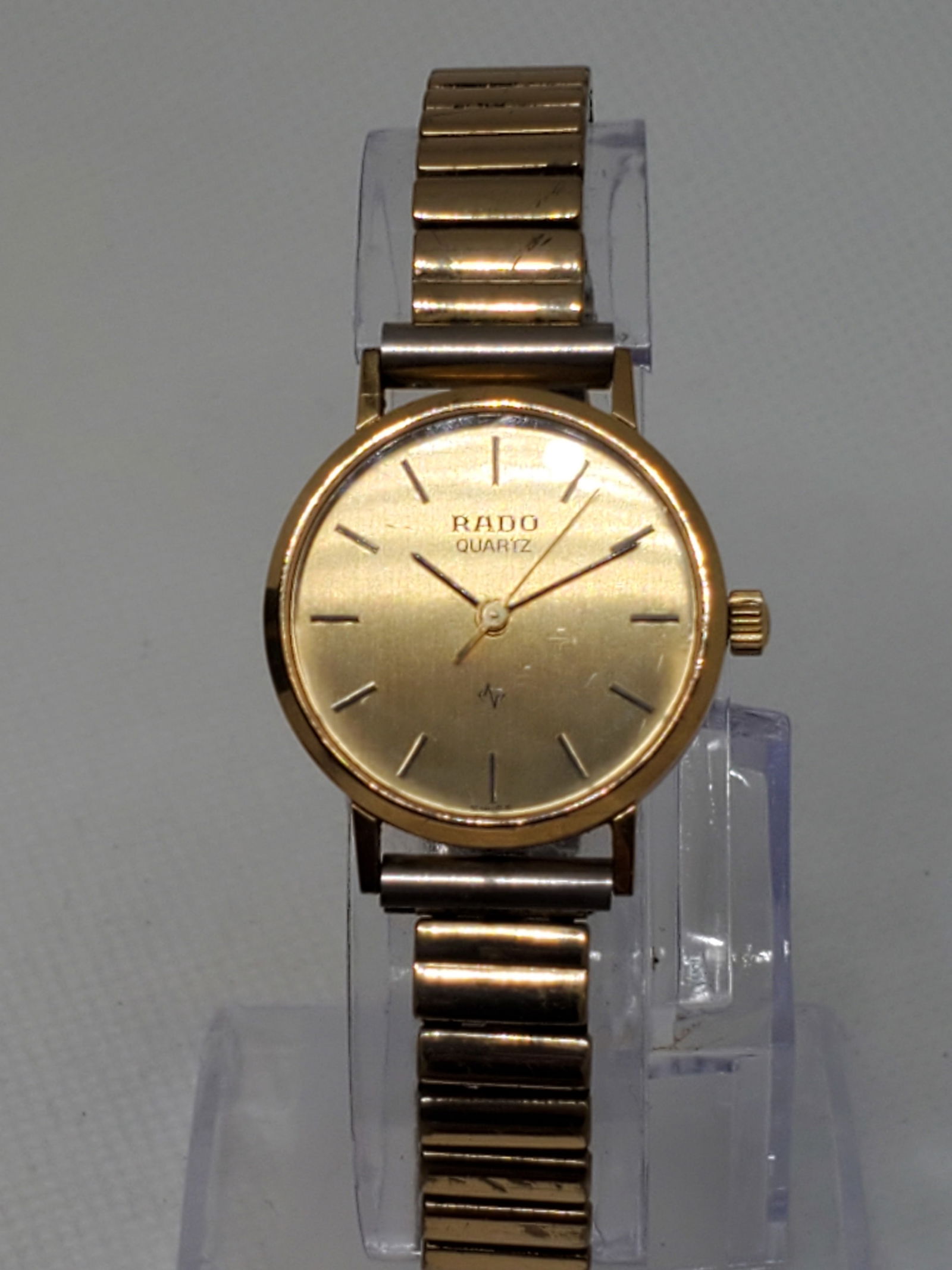 Rado Gold Plated Ladies Watch, 1980s: Indulge in the timeless elegance of the Rado 110.5167.2 running , a luxury timepiece that blends prestige, refinement, and durability. This exquisite watch features a gold plated case that radiates so