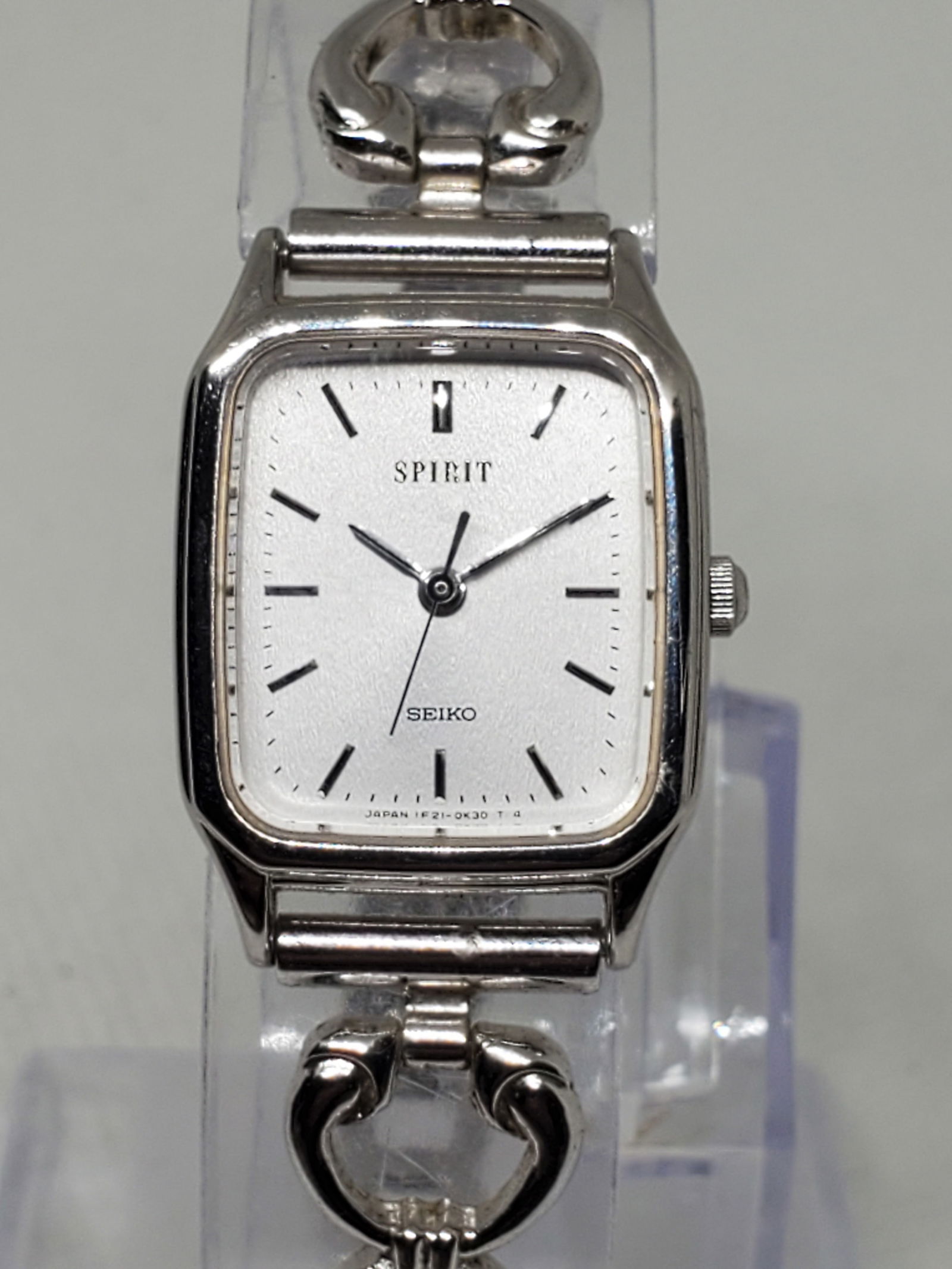 Seiko Spirit Tank Ladies Watch, 1996: This refined Seiko Spirit 1F21 5B20 is a testament to minimalist elegance and reliable Japanese craftsmanship. Powered by a precise quartz movement, it features a clean silver dial housed in a compact