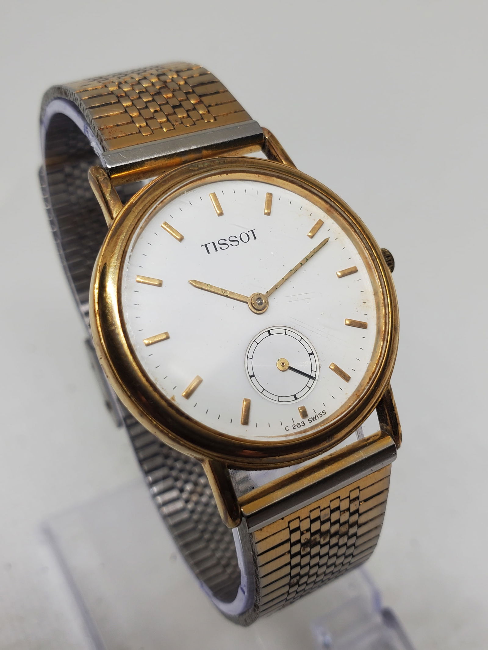 Tissot C263 Gold Plated White Dial Swiss Watch w Seconds Sub-Dial, 1985 to 1995: This Tissot C263 dress watch exemplifies the refined Swiss craftsmanship and timeless elegance of a brand founded in 1853 in Le Locle Switzerland by Charles Felicien Tissot and his son Charles Emile,