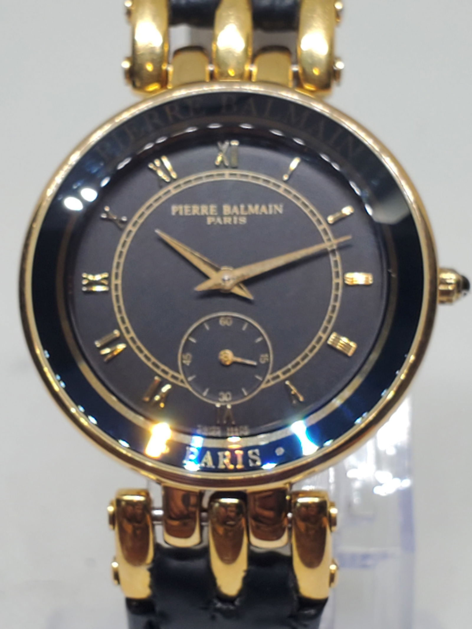 Pierre Balmain Paris Quartz Sub Seconds Black Dial Gold Dress Watch, 1990s: This Pierre Balmain Paris model 176.3040.5 quartz dress watch reflects timeless elegance and refined prestige, featuring a gold plated case with crystal bezel, a sophisticated black dial with classic
