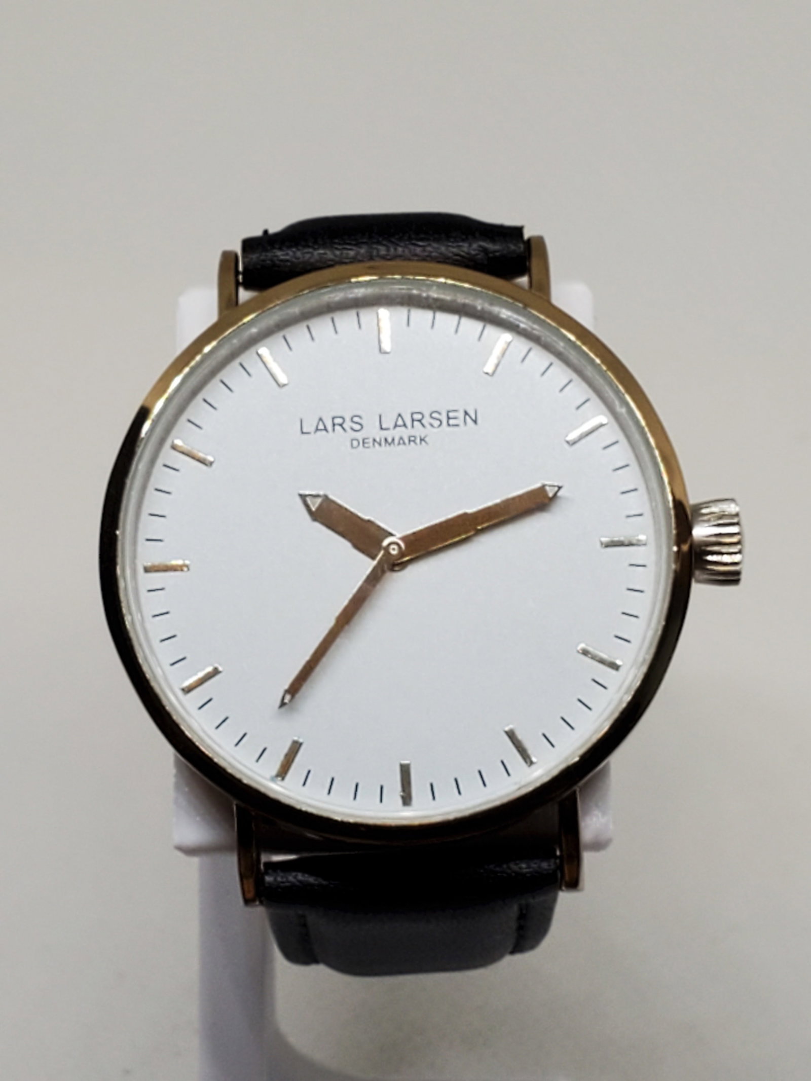 Lars Larsen Denmark Gold Plated Watch, 2010s: This Lars Larsen 316L watch is a true blend of elegance and timeless simplicity, perfect for those who appreciate refined casual style. With its gold-plated case and sleek white dial, this timepiece e