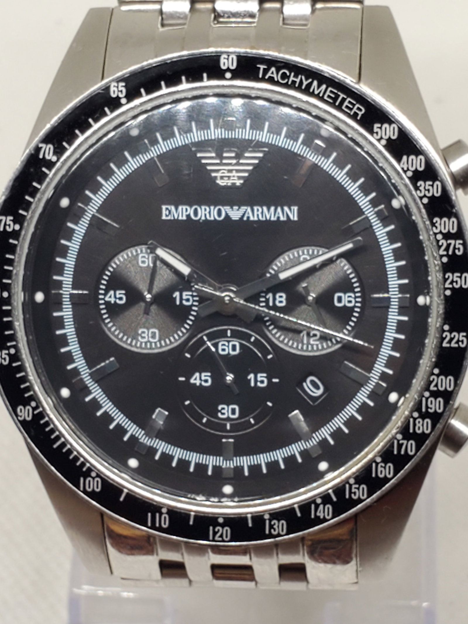 Emporio Armani AR-5988 Chronograph Tachymeter Black Dial Stainless Steel 46mm, 2014: This Emporio Armani AR-5988 combines modern sophistication with the sport-inspired functionality that defines the brand?s prestige. Crafted with a durable silver-tone stainless steel case and bracelet