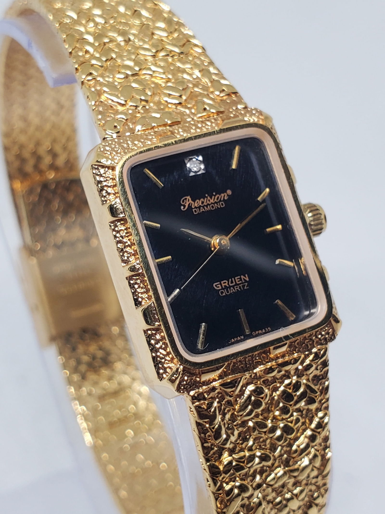 Gruen Precision Diamond Black Dial Gold Nugget Bracelet Vintage Quartz Watch, 1980s: This elegant Gruen Precision 225-Y121 dress watch exemplifies refined vintage style and understated prestige, making it a sophisticated choice for both formal wear and refined daily use. Founded in 18