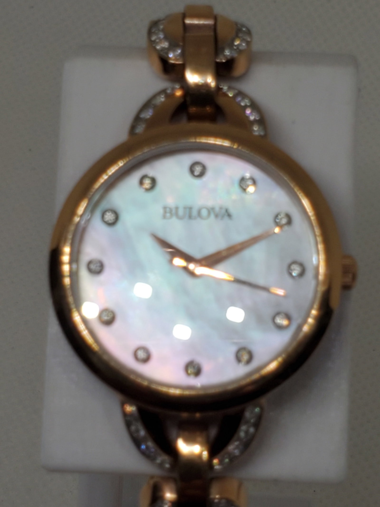 Bulova Crystal 98L207 Rose Gold Women?s Watch Mother of Pearl, 2000s: Bulova 98L207 Quartz watch with 28mm rose gold plated case, mother of pearl dial with crystal markers, and rose gold metallic bracelet with crystal accents (6?). A dress watch combining elegance and p