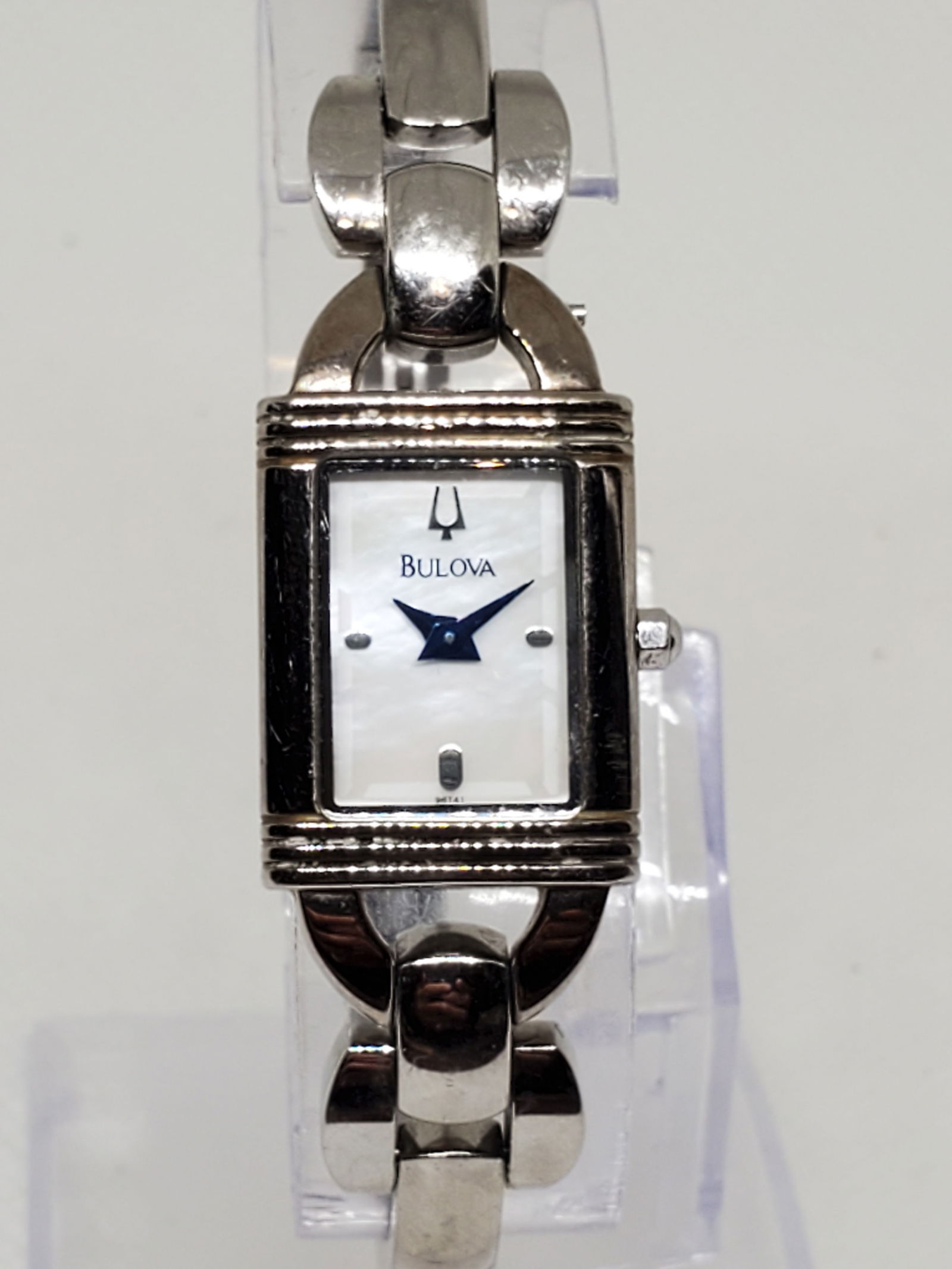 Bulova Mother of Pearl Ladies Watch, 2000s: Elegance and prestige come together in this Bulova C8671211 dress watch, a refined piece designed for sophistication and everyday durability. Featuring a silver tone case with a radiant mother of pear