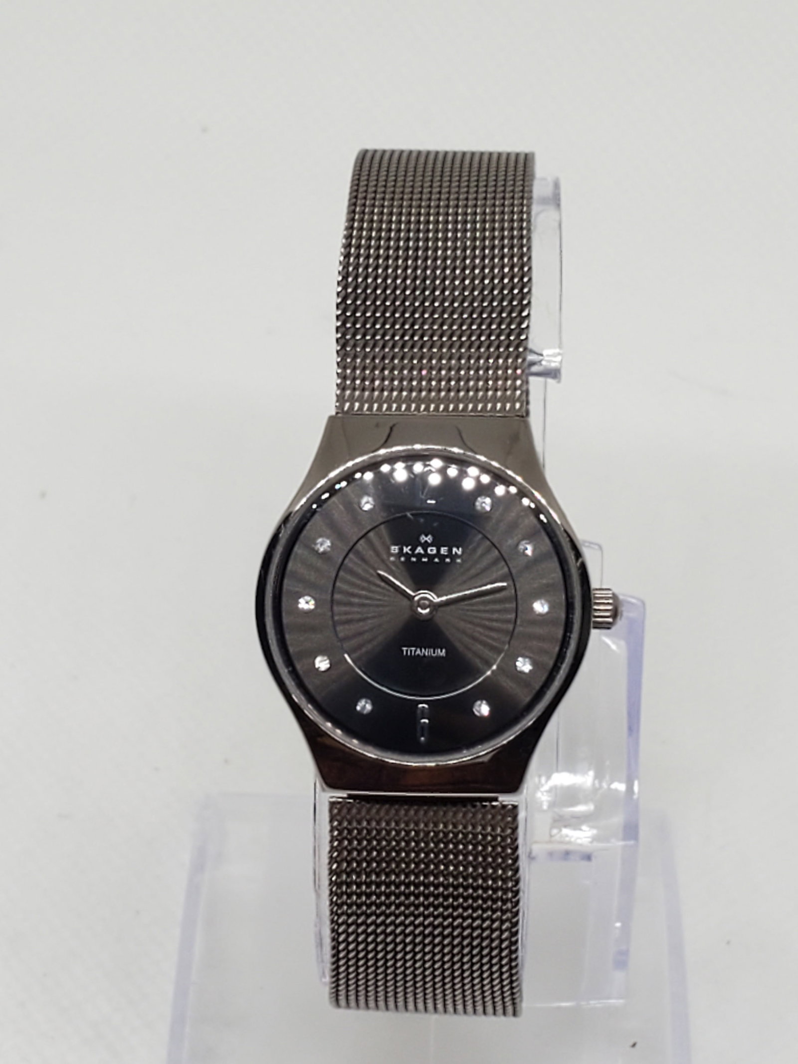 Skagen Titanium Watch with Rhinestones, 2000s: Embrace sleek Danish design with the Skagen 233XSTTM running, a refined quartz dress watch that blends minimalism with a touch of sparkle. Featuring a lightweight titanium case measuring a delicate 0.