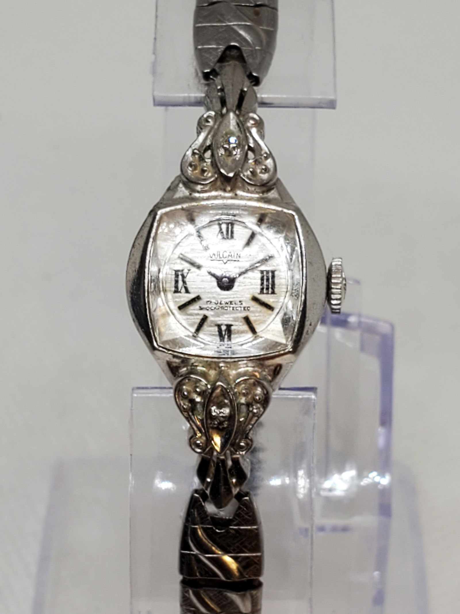 Vintage Vulcain Cocktail 17 Jewels Manual Ladies Watch Diamond Accents, circa 1958 to 1962: This elegant Vulcain Cocktail ladies watch embodies Swiss refinement and mid century glamour. Crafted with a silver tone case and guilloche patterned dial, it features classic Roman numerals and spark