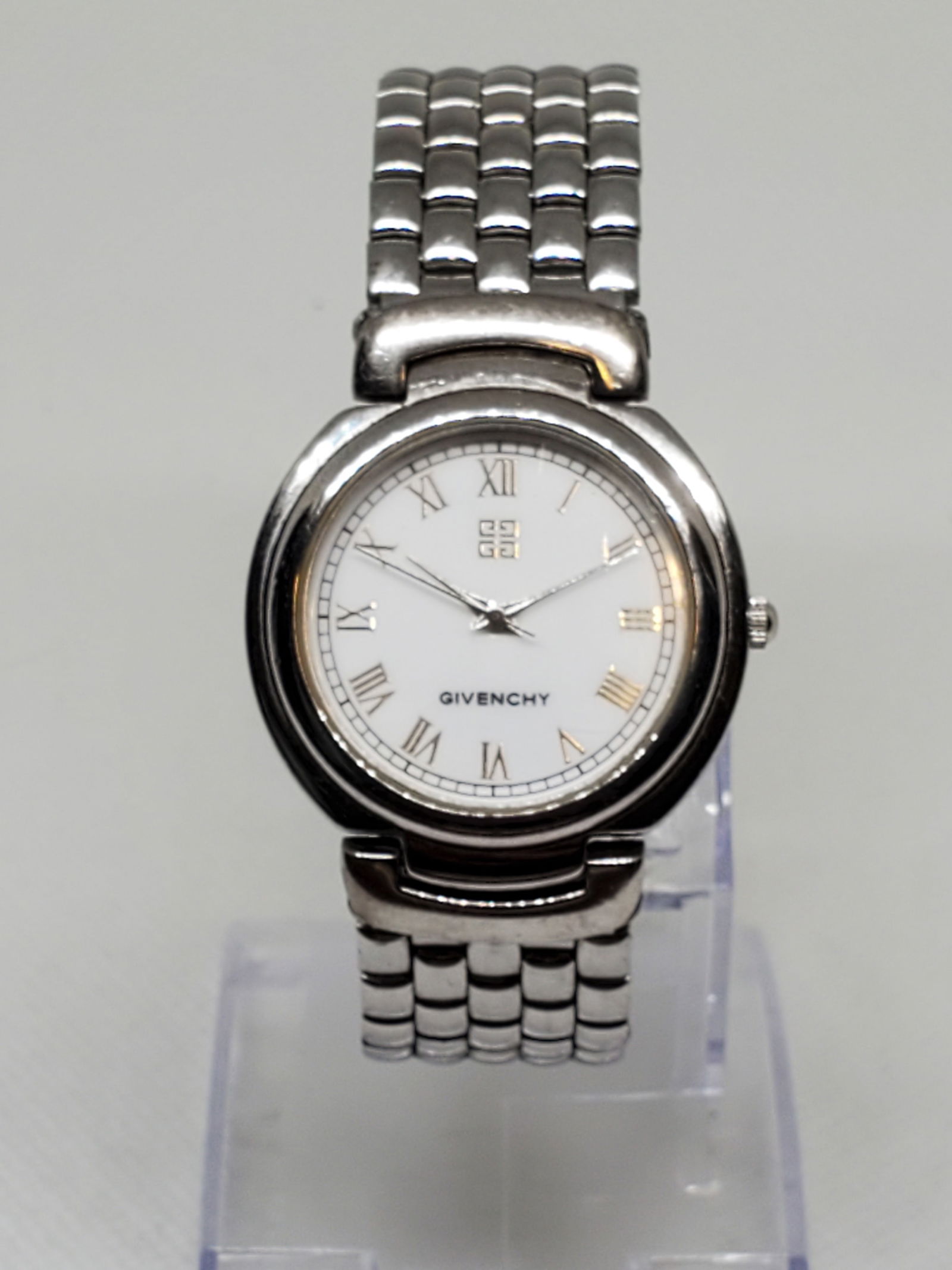 Givenchy Cruise Silver Tone Ladies Watch, 1990s: This elegant Givenchy Cruise 109 reflects the timeless prestige of the French fashion house. Designed with a silver tone case and a clean white dial adorned with Roman numerals, it embodies understate