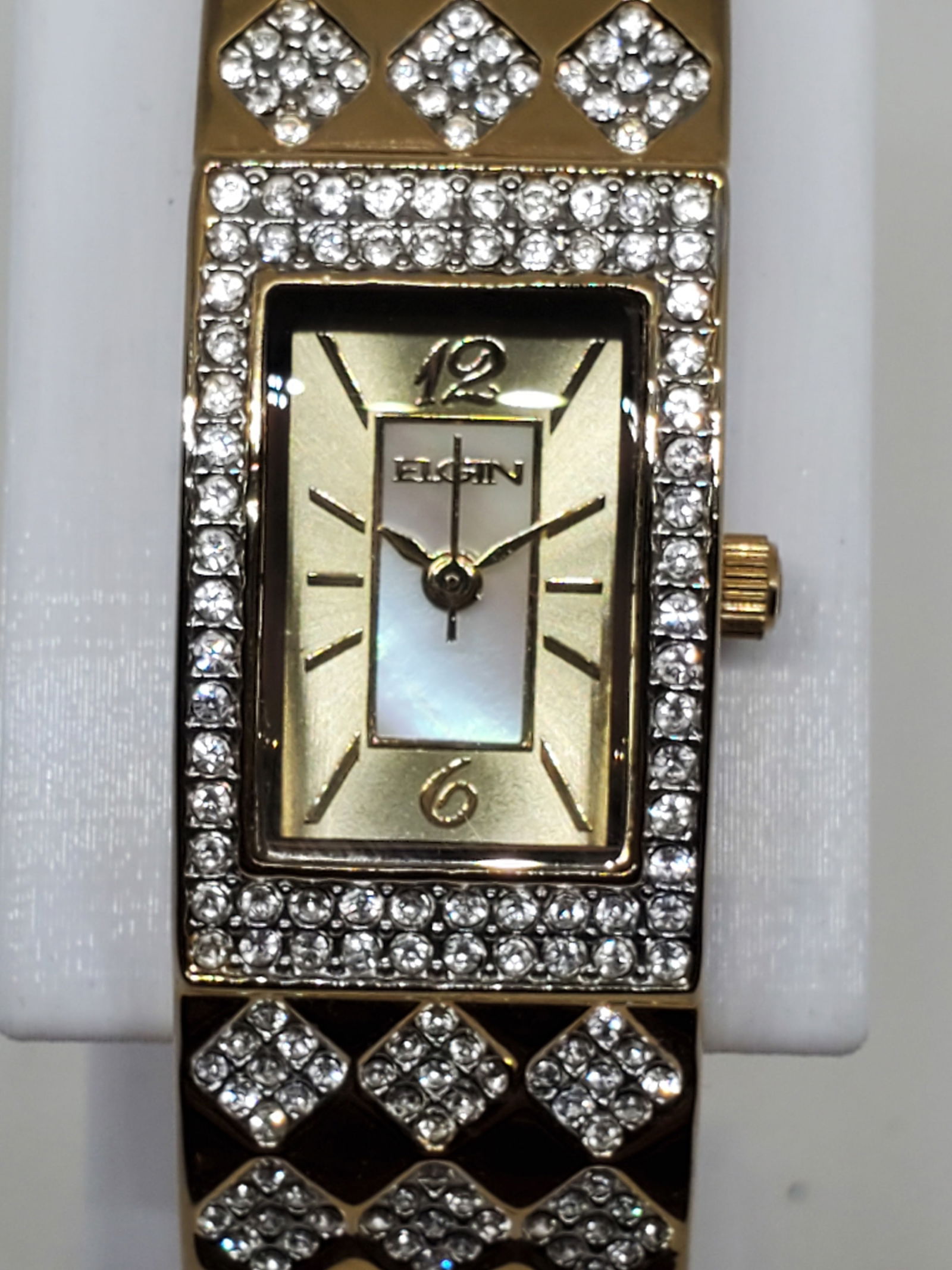 Elgin EG9101ST Womens Gold Tone Quartz Dress Watch with Crystal Accents, 1990s: This Elgin EG9101ST womens quartz dress watch radiates elegance and sophistication, designed for those who appreciate refined style and timeless charm. Featuring a gold tone case with a matching gold