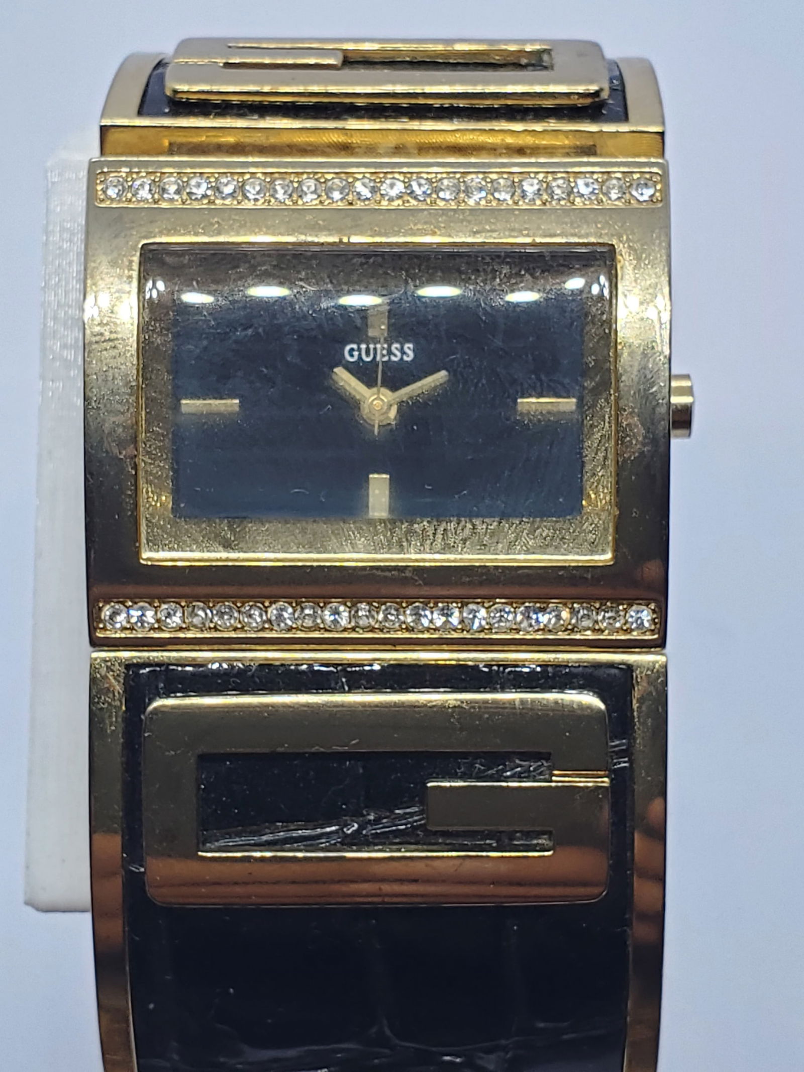 Vintage Guess Gold Tone Dress Watch Black Dial Bezel Crystals, 2000s: The Guess W16550L2 quartz dress watch blends bold fashion design with everyday elegance, reflecting the modern prestige and durable style that made Guess a popular name among contemporary watch collec