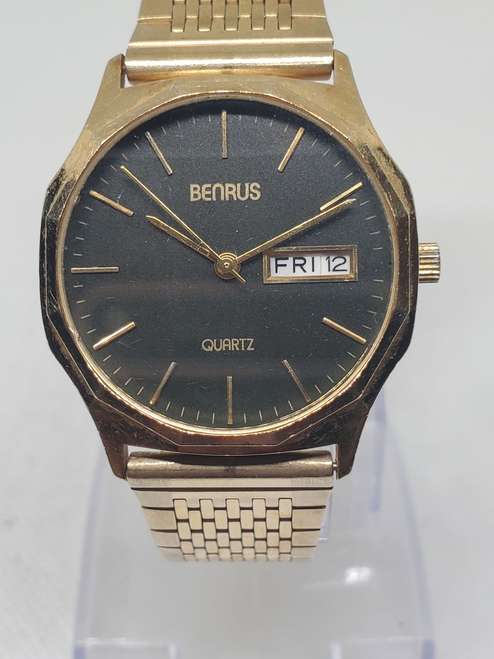 Benrus Gold Plated Quartz Dress Watch Black Dial Day Date Swiss Style, late 1980s: This classic Benrus quartz dress watch presents a refined blend of elegance, prestige, and everyday reliability, making it a timeless addition to any collection. Featuring a gold plated case paired wi