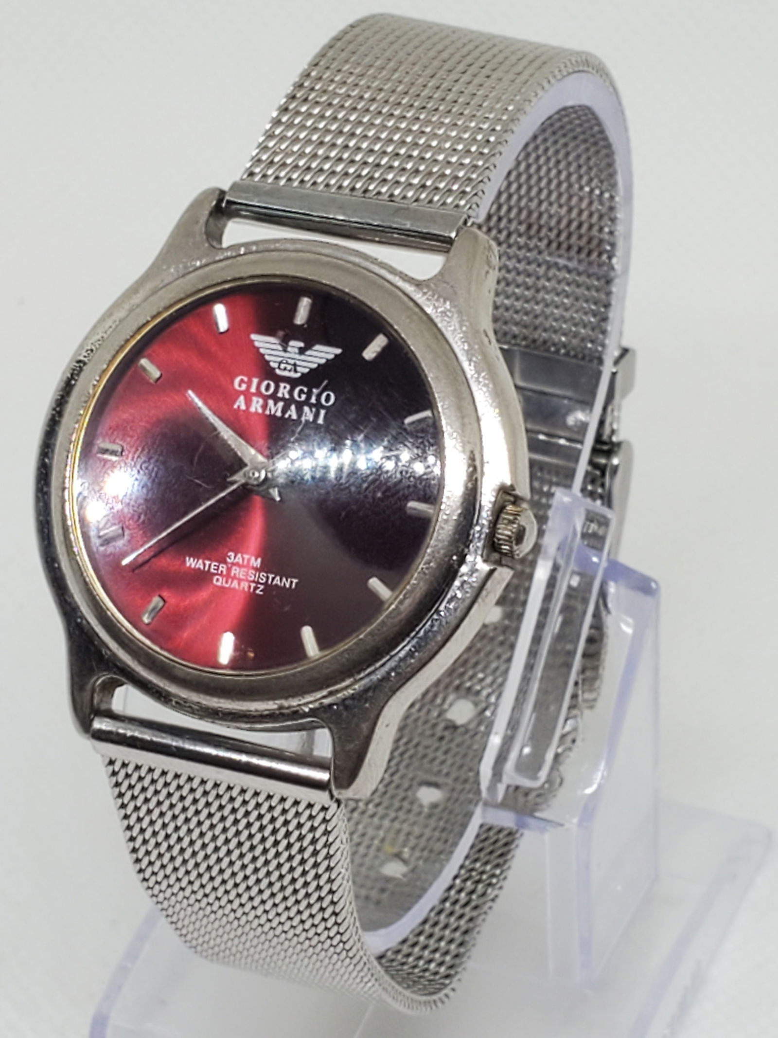Vintage Giorgio Armani 36688 Watch Purple Dial 34mm, 1990s: This Giorgio Armani 36688 quartz dress watch showcases the refined elegance and prestige of the Armani name, blending minimalist Italian design with timeless durability. The watch features a silver to
