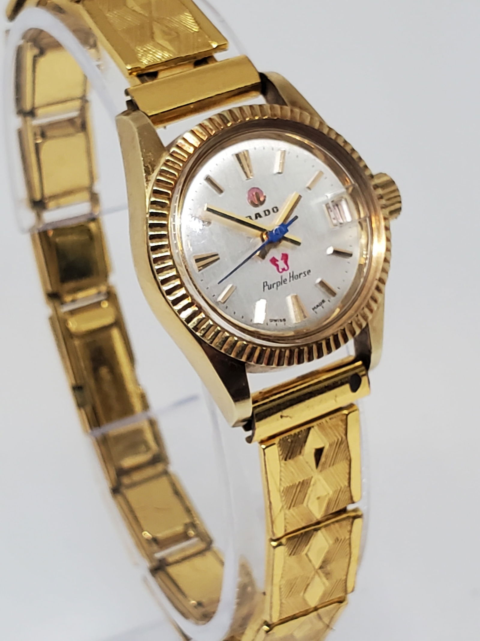 Rado Purple Horse *Rotating Anchor Logo* Gold Plated Automatic Watch, 1970s, Working: Working condition Rado Purple Horse 395.7951.2, a watch that effortlessly combines elegance, durability, and the prestigious heritage of the Rado brand. This luxurious timepiece features an 18K gold p