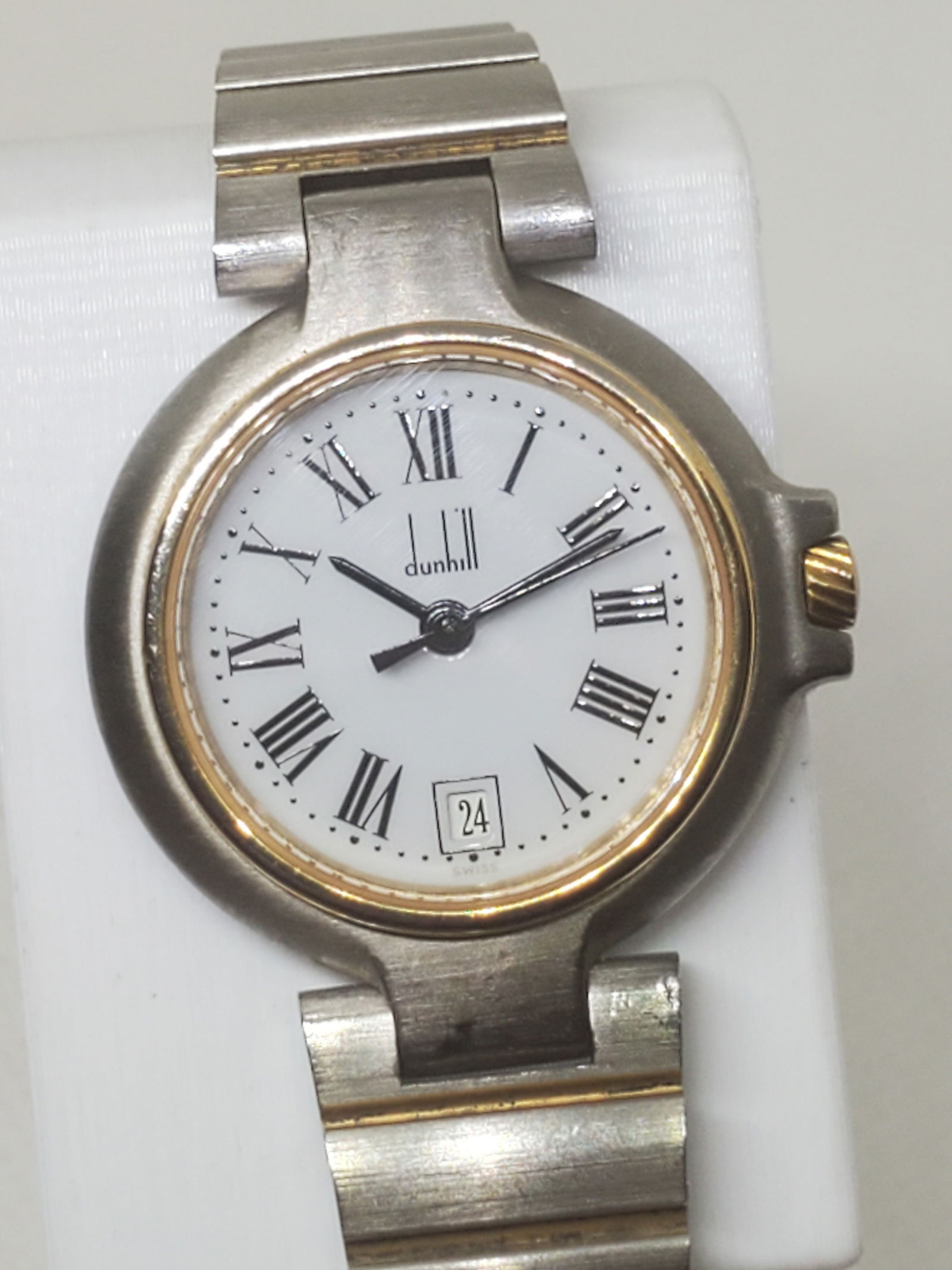 Dunhill Millenium Dual Tone Gold Plated Bezel Watch, 1990s, Working: Working condition Dunhill Millenium X00 watch is a statement of elegance and refined luxury, embodying the sophistication synonymous with the Dunhill brand. The dual tone design with a gold plated bez