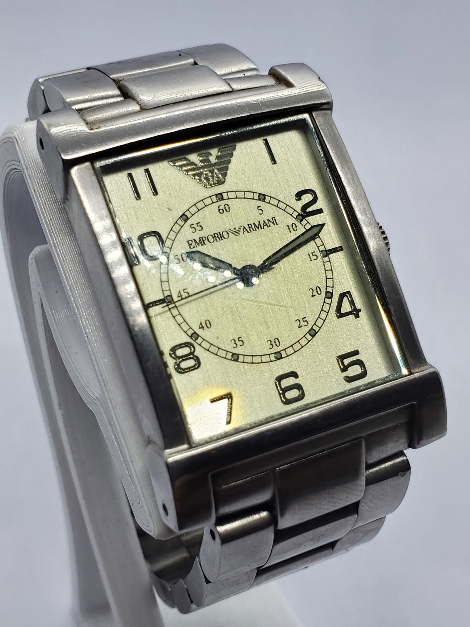 Emporio Armani Champagne Gold Dial Tank Dress Watch, 2000s, Working: This Emporio Armani AR-0216 quartz dress watch reflects the refined Italian elegance and modern prestige that define the Emporio Armani brand, founded by Giorgio Armani in 1975 in Milan Italy and cele