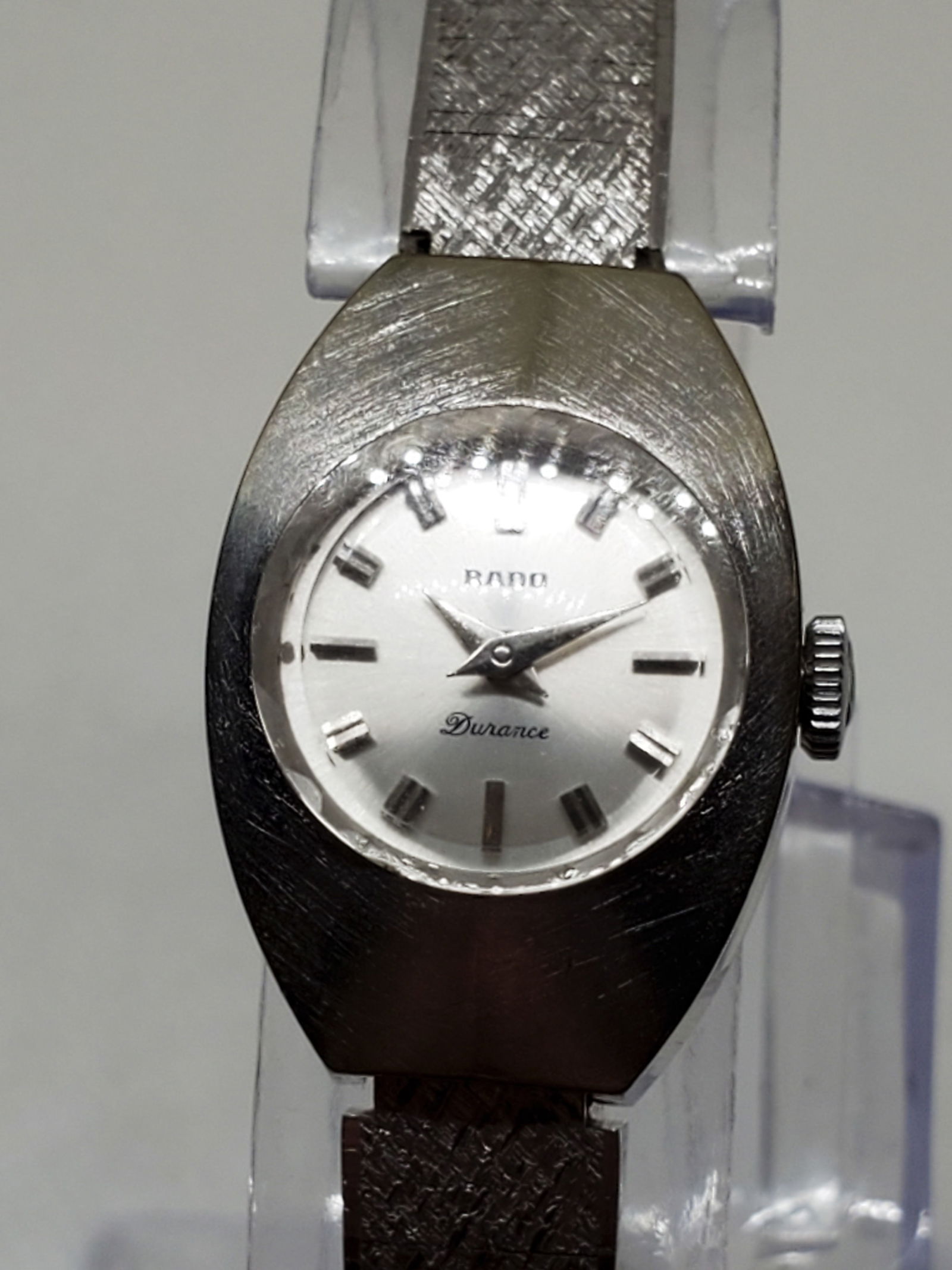 Rado Durance Silver Tone Ladies Manual Watch, 1970s, Working: Discover timeless elegance with the Rado Durance, in working condition, a watch that embodies sophistication and precision. This exquisite timepiece features a silver tone stainless steel case that se