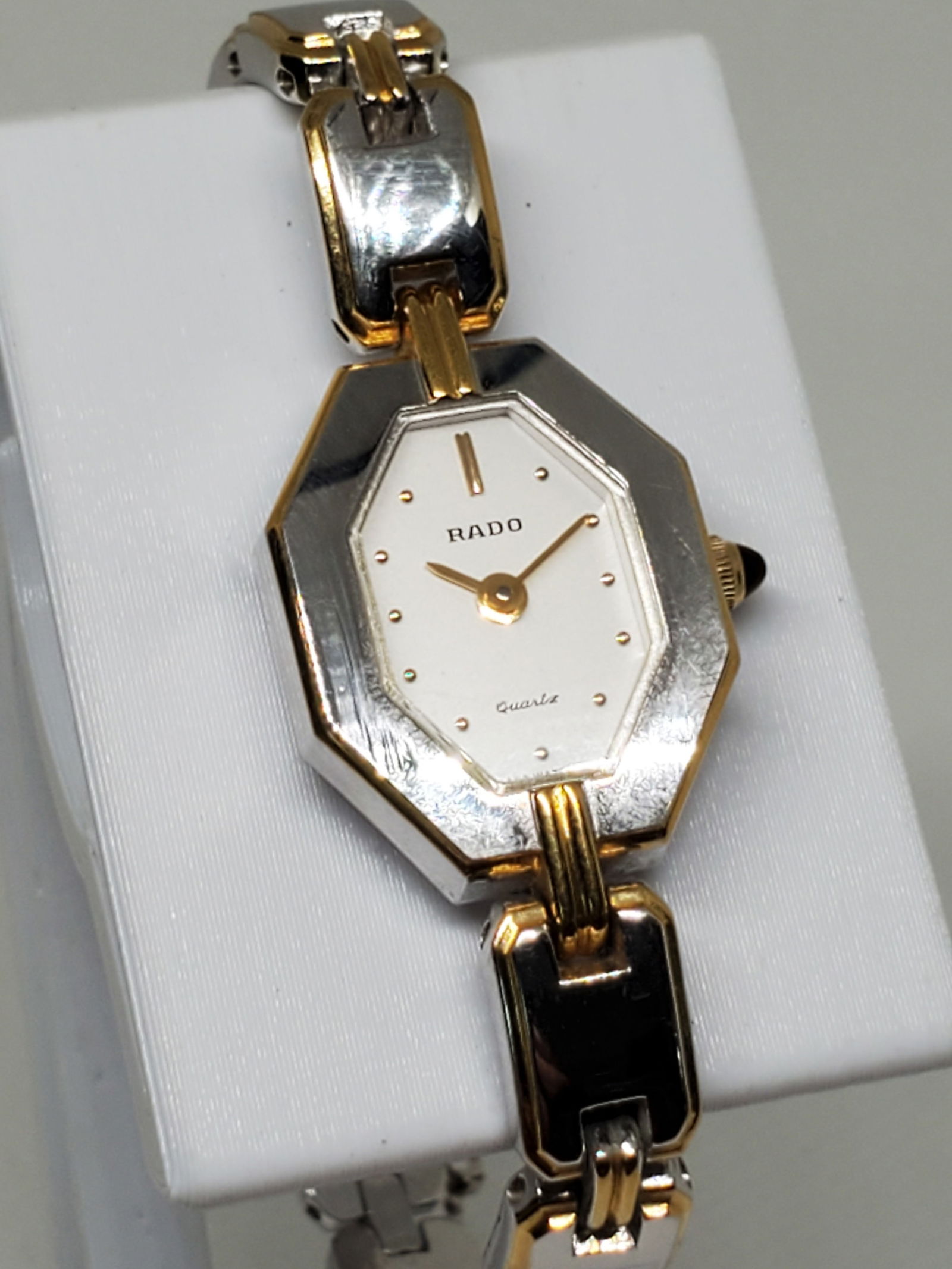 Rado Two Tone Silver & Gold Watch, 1980s, Working: Working condition Rado 133.9626.2, a stunning blend of elegance and precision that showcases Rado's renowned craftsmanship. This luxury watch features a striking silver and gold octagonal case, which