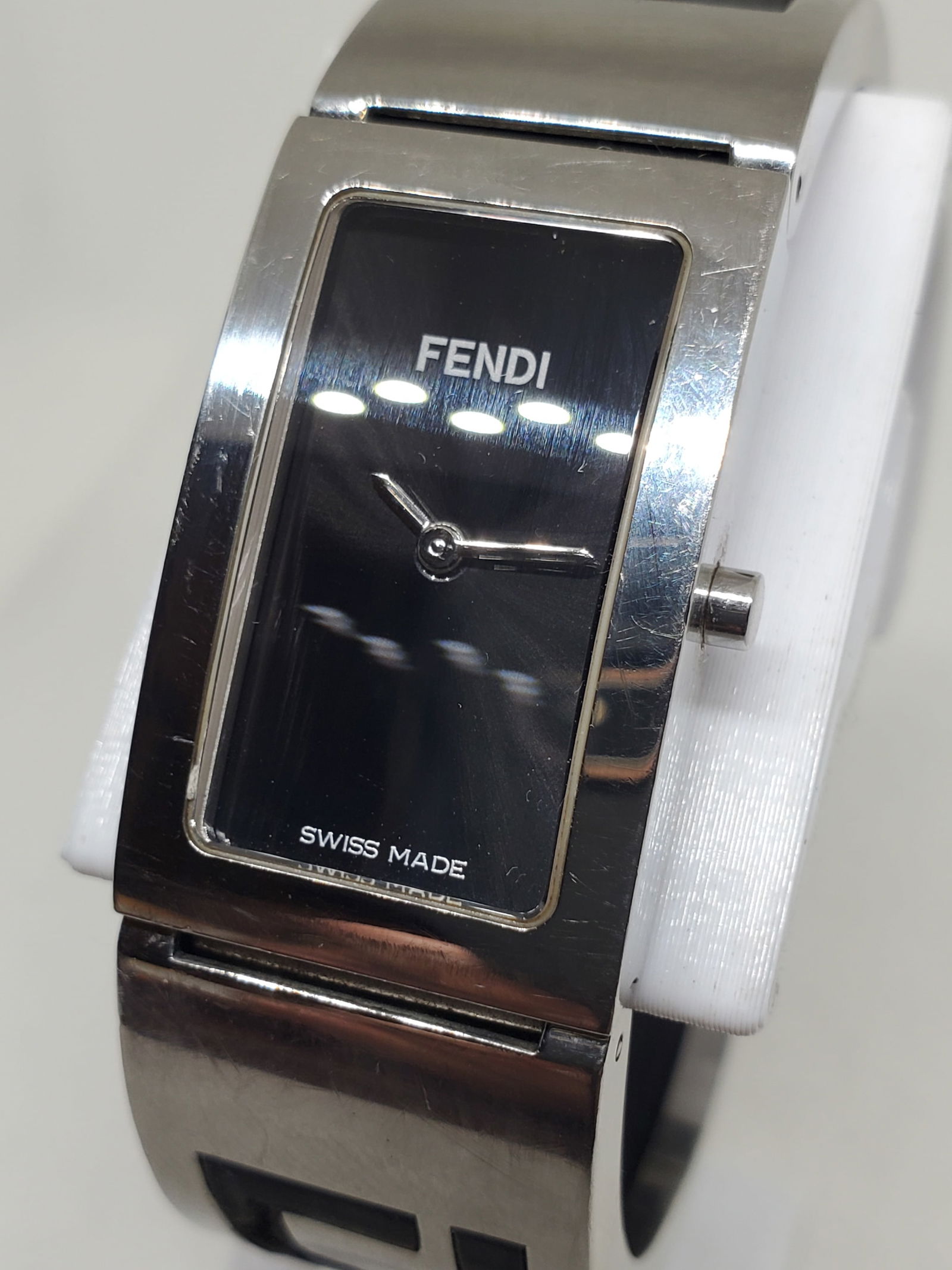 Fendi 3250L Swiss Quartz Dress Watch Silver Case Black Dial Bangle, 1990s, Working: This Fendi 3250L dress watch embodies refined Italian elegance combined with Swiss precision, offering a minimalist aesthetic that reflects the brand?s fashion heritage and timeless prestige. Designed