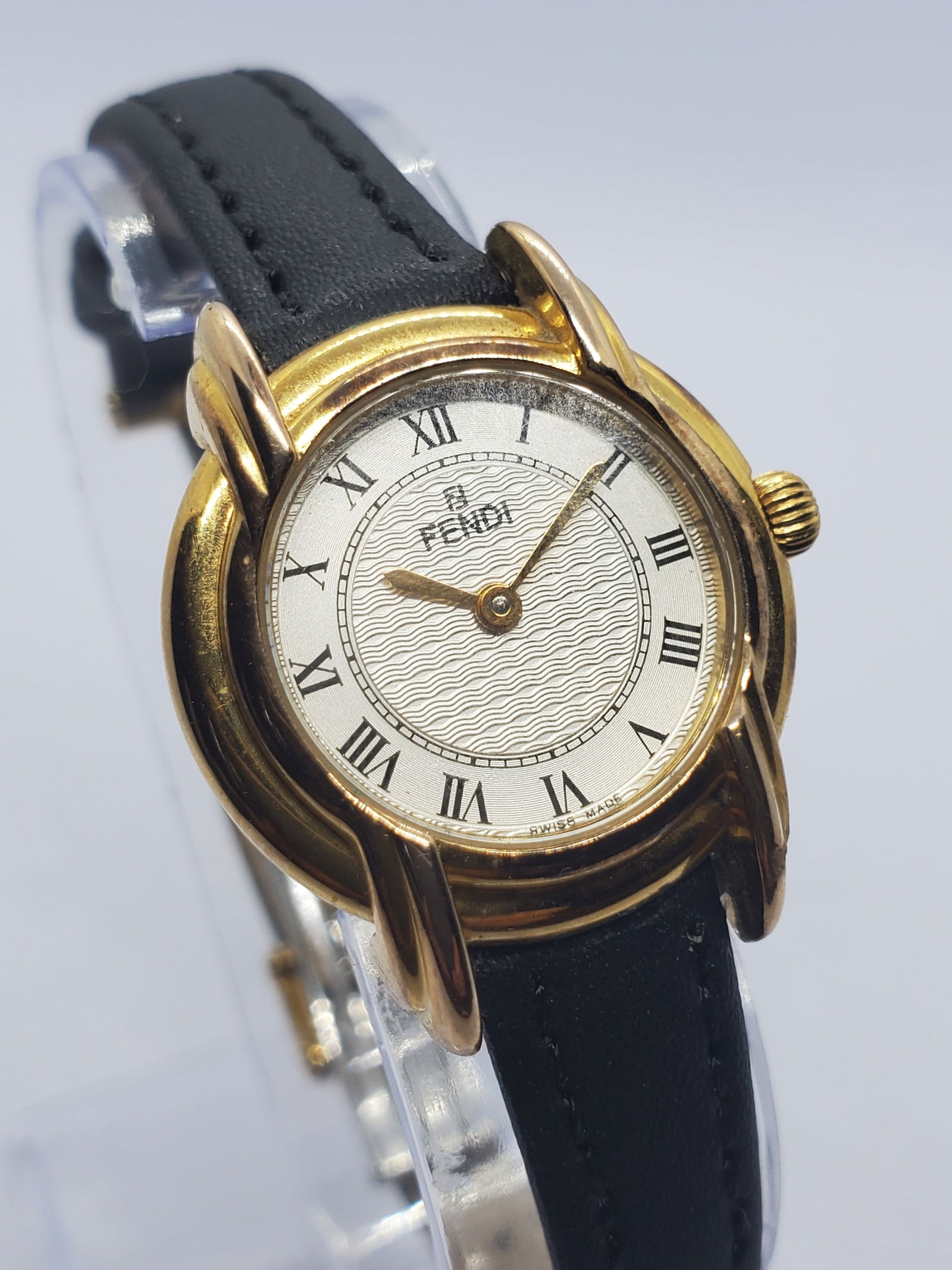 Vintage Fendi Roman Classic Gold Plated Swiss Dress Watch, 1990s, Working: The Fendi Roman Classic 057350L661 is an elegant Swiss made dress watch that reflects the luxury heritage of Fendi, founded by Adele and Edoardo Fendi in 1925 in Rome, Italy. Known for refined Italian
