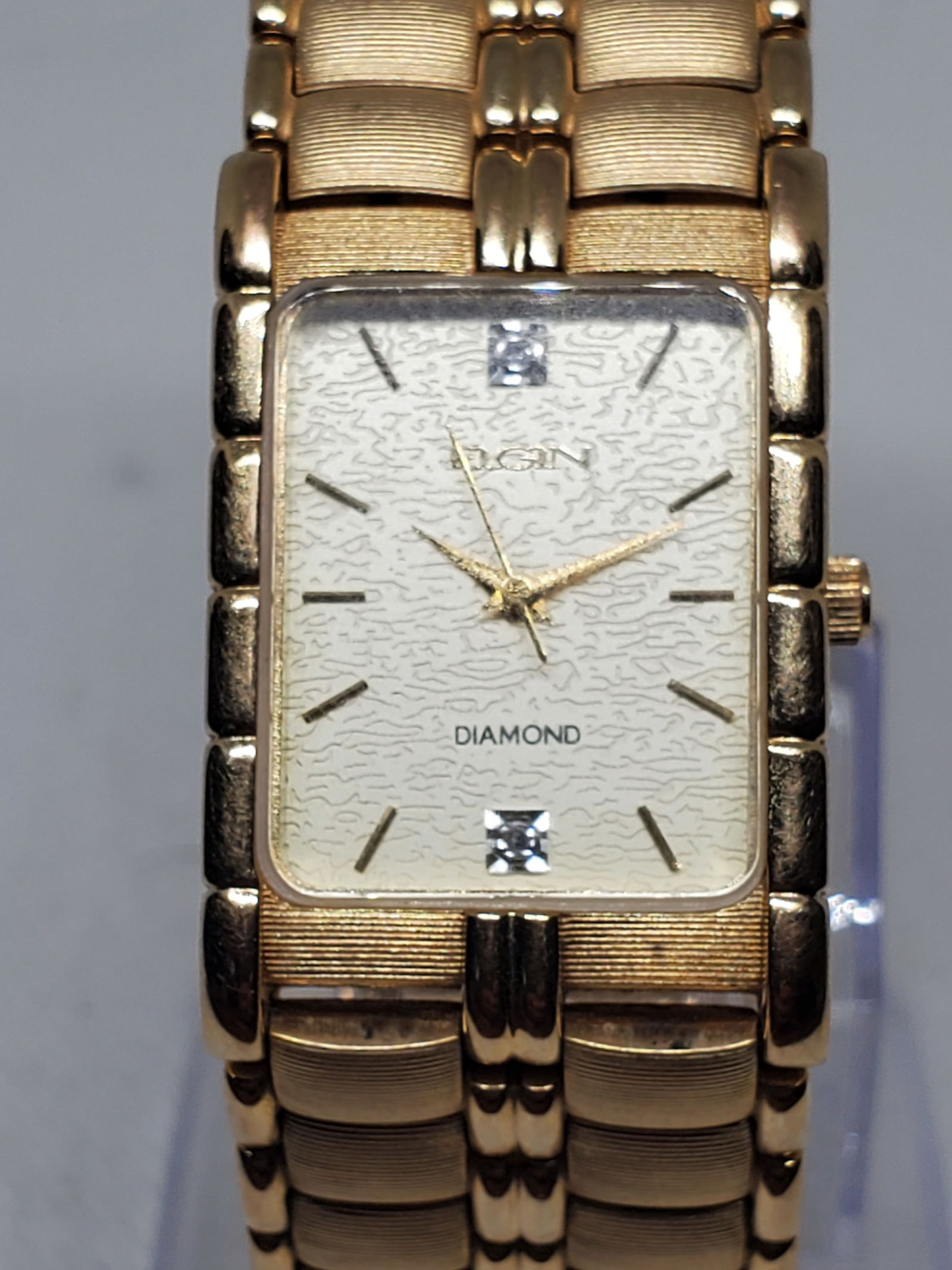 Elgin FM846B Gold Tone Diamond Rectangular Dress Quartz Watch, 1995, Working: This elegant Elgin FM846B quartz dress watch showcases timeless prestige with its gold tone rectangular case accented by two diamond markers and a refined minimalist dial, making it ideal for formal o