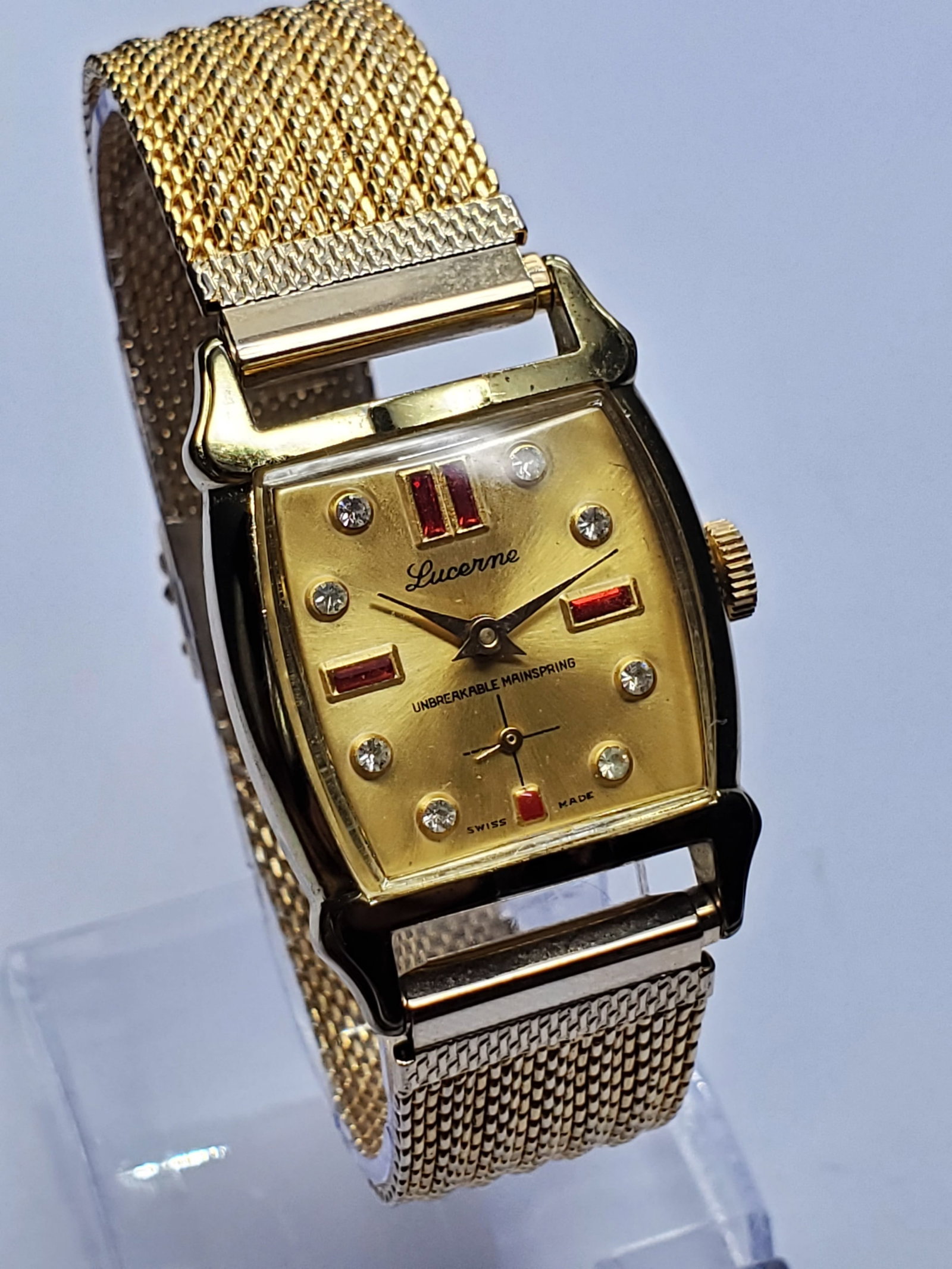 Lucerne Art Deco Gold Plated Jeweled Style Ladies Swiss Manual Tank Watch, 1950s, Working: This elegant Lucerne Art Deco manual wind dress watch showcases the refined design and charm of mid century Swiss watchmaking. The watch features a gold plated tank case measuring 26 mm by 26 mm paire
