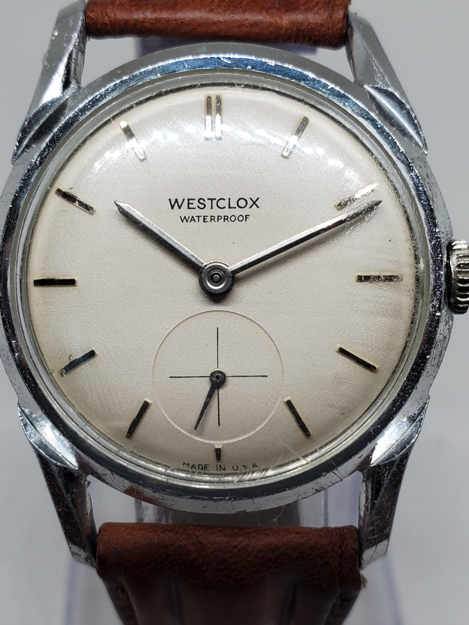 Vintage Westclox Manual Wind Watch White Dial Seconds Sub-dial 34mm USA, mid 1950s to early 1960s,: This vintage Westclox embodies the clean elegance and practical durability that made the American brand a household name for decades. Featuring a silver tone case and a classic white dial with a refin