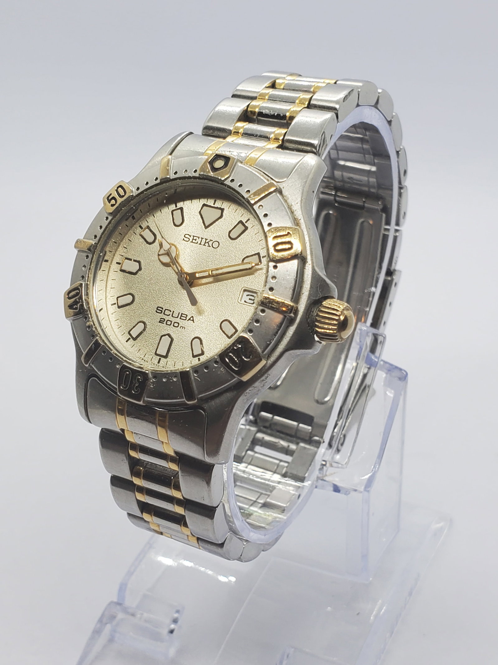 Seiko Scuba 7N35-6010 Diver 200m Quartz Silver Dial Two Tone Bracelet, 1990s, Working: This Seiko Scuba model 7N35 6010 showcases Seiko?s renowned balance of elegance, precision, and real world durability, making it a strong choice for vintage sport watch collectors. Founded in 1881 in