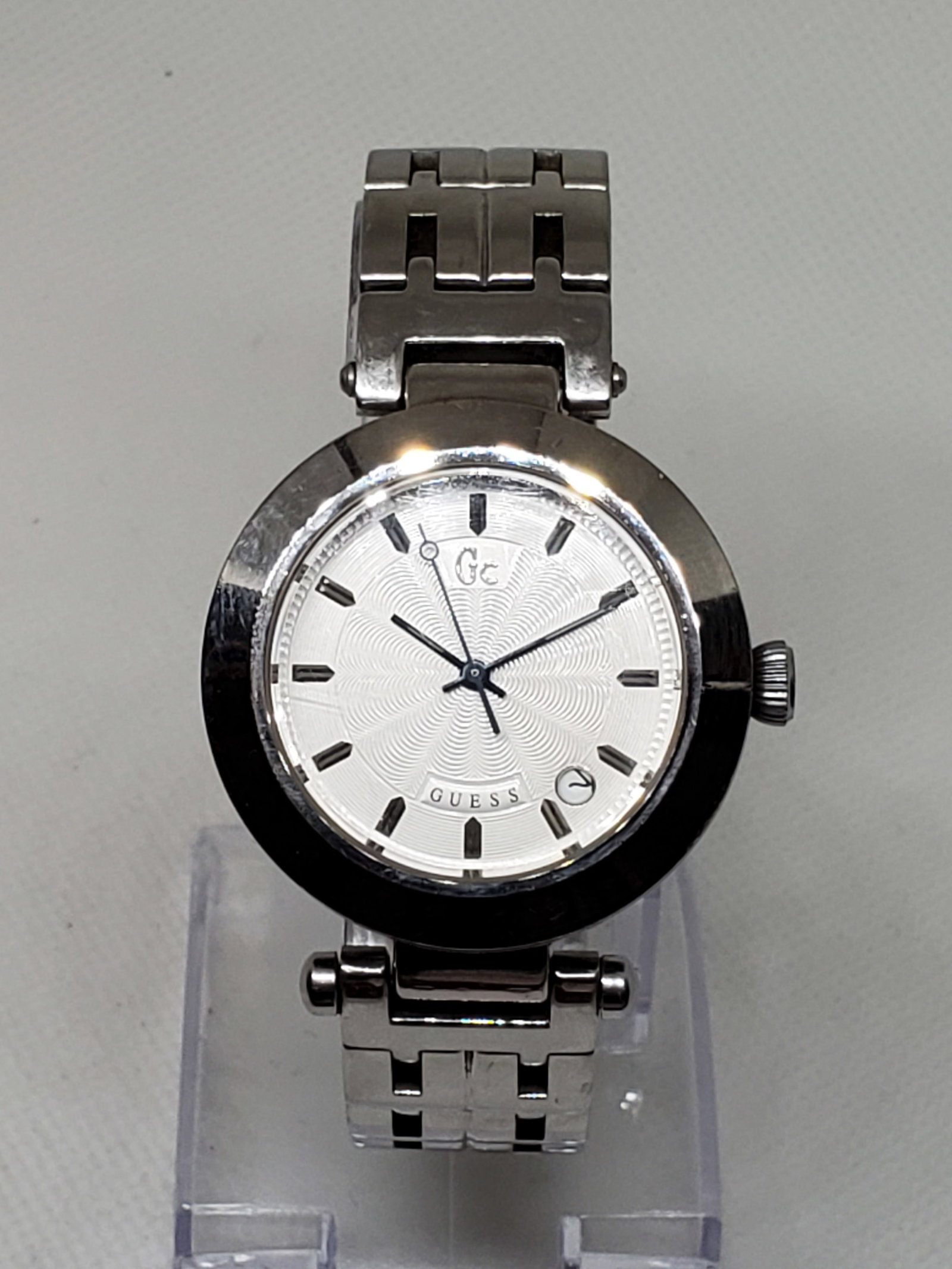 Guess Collection Silver Tone Watch for Men, 2000s, Working: Guess Collection GC8000 in operation, a refined timepiece that embodies elegance and sophistication. Featuring a sleek silver tone case and a crisp white dial with a date display, this watch is a time