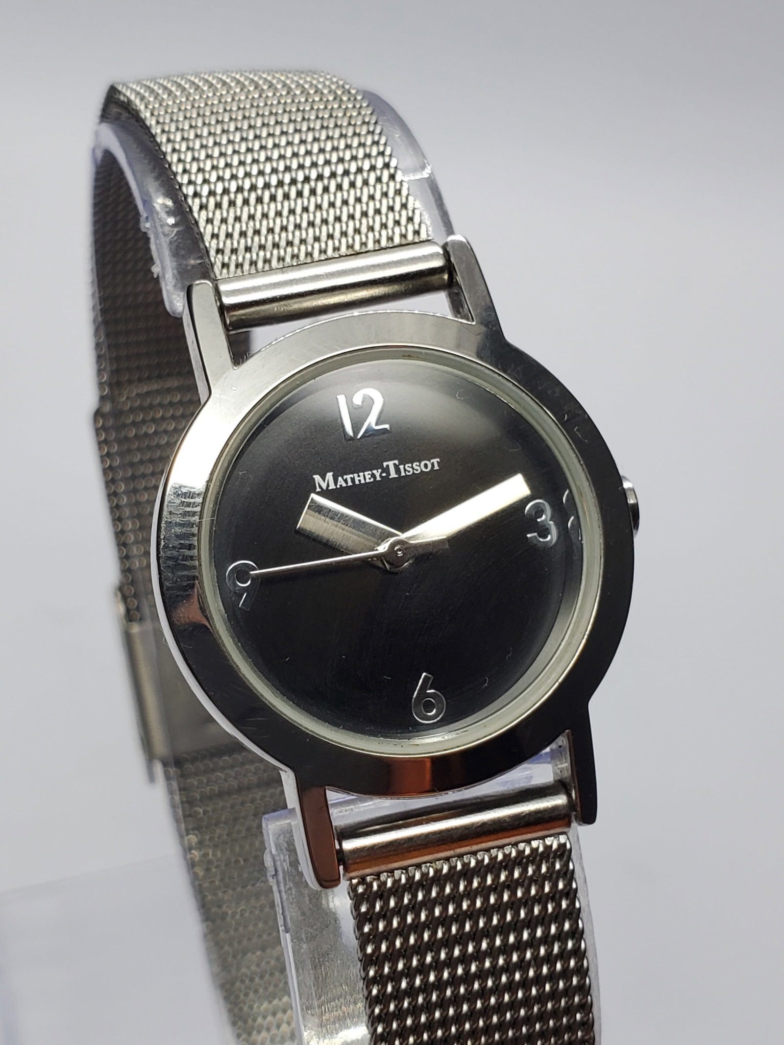 Mathey Tissot Classic Black Dial Dress Watch Swiss, 1995 to 2005, Working: This elegant Mathey Tissot Model 41509 quartz dress watch reflects the refined aesthetic and heritage of one of Switzerland?s historic watchmakers. The watch features a sleek silver tone case measurin
