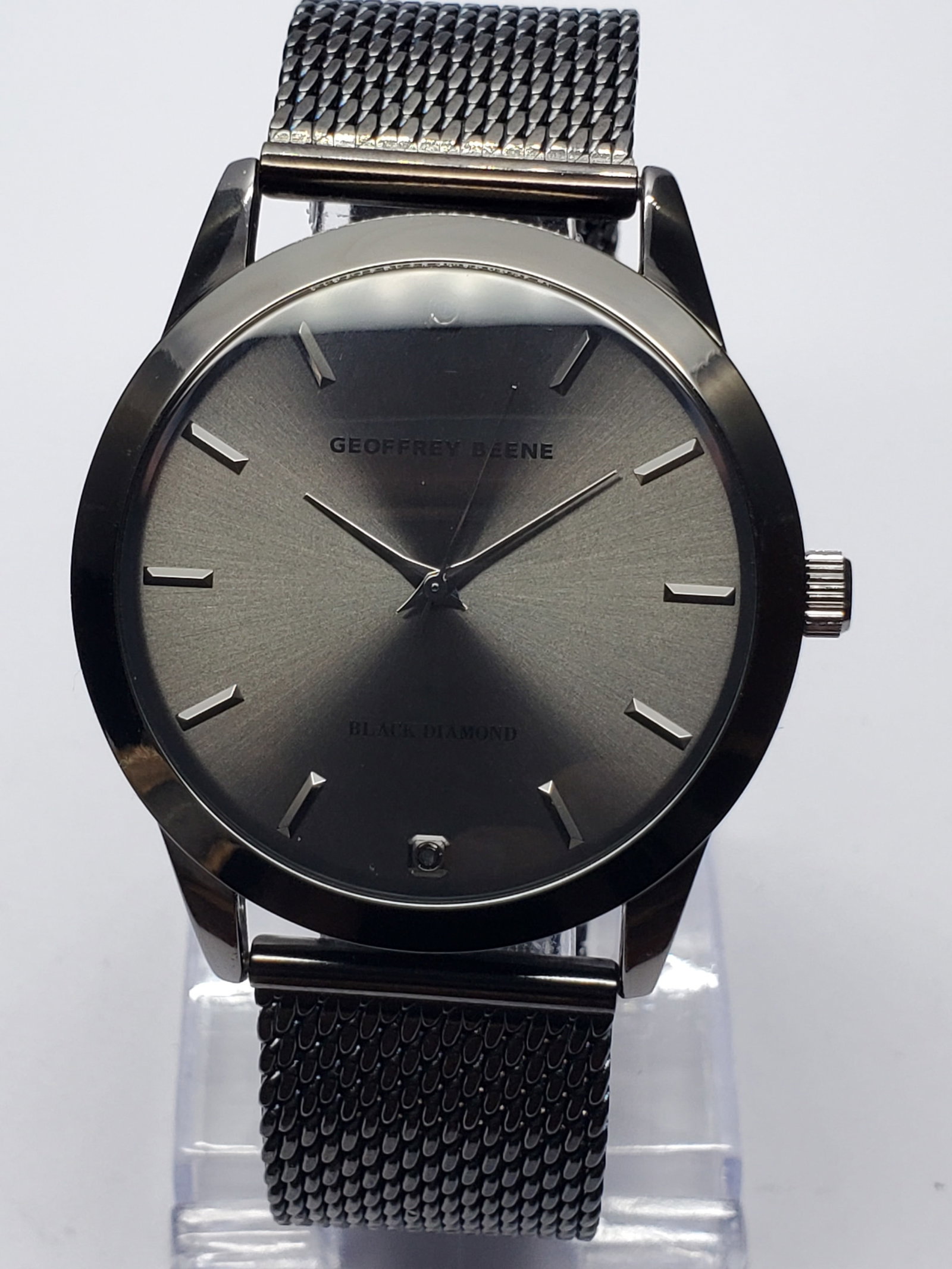 Geoffrey Beene Dark Gray Diamond Black Dial Watch, 42mm, New in Box, Working: This Geneva GB8207GU.K0 wristwatch embodies a blend of modern elegance and practical style, perfect for both formal and casual settings. Featuring a dark gray tone case with a darg gray dial, it exude