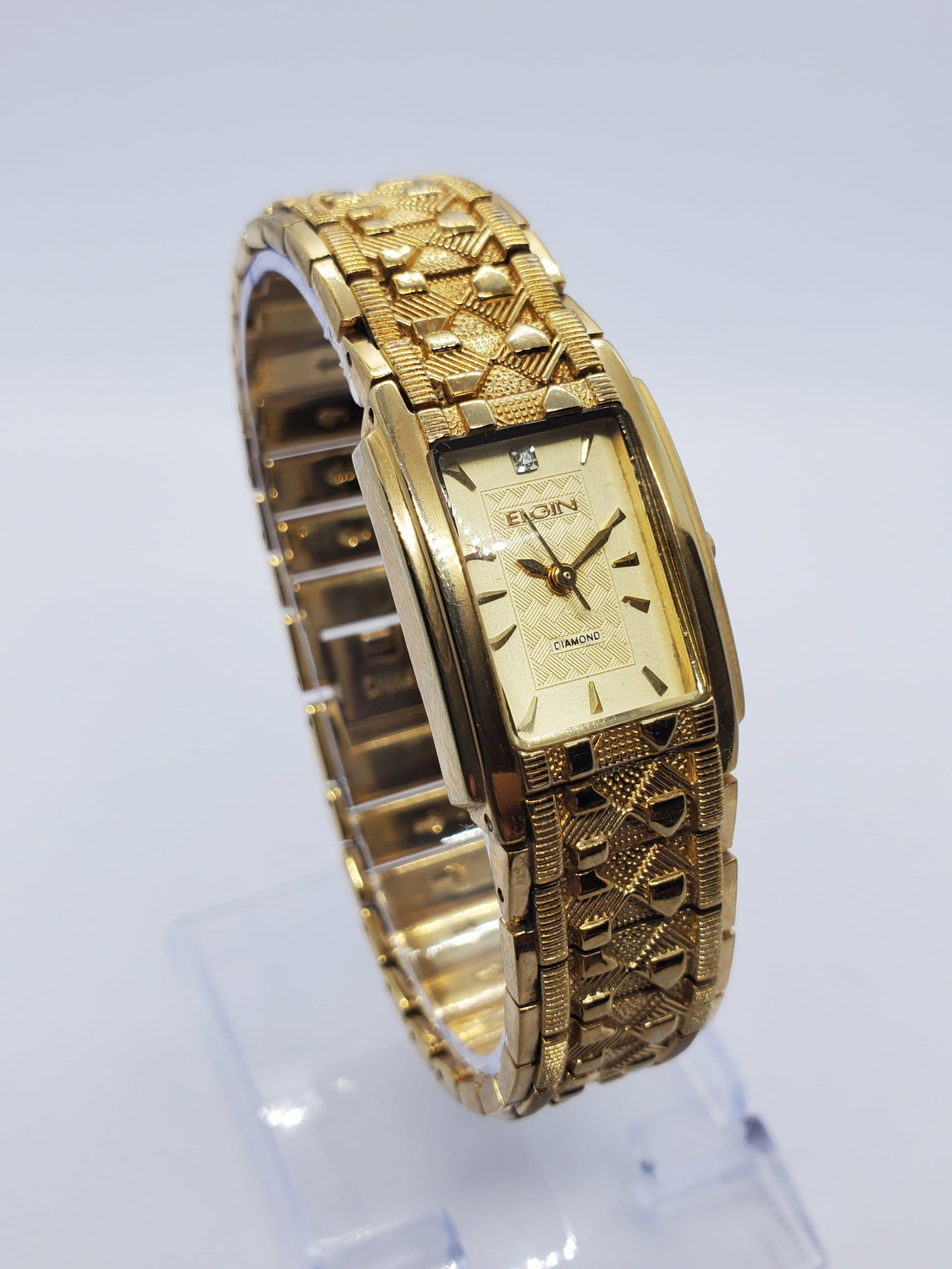 Vintage Elgin Diamond Gold Tone Tank Quartz Dress Watch Bracelet, 1990, Working: This elegant Elgin EG286NG quartz watch showcases timeless sophistication with a gold plated tank case and a richly textured gold tone pattern dial accented by a genuine diamond marker, offering a ref