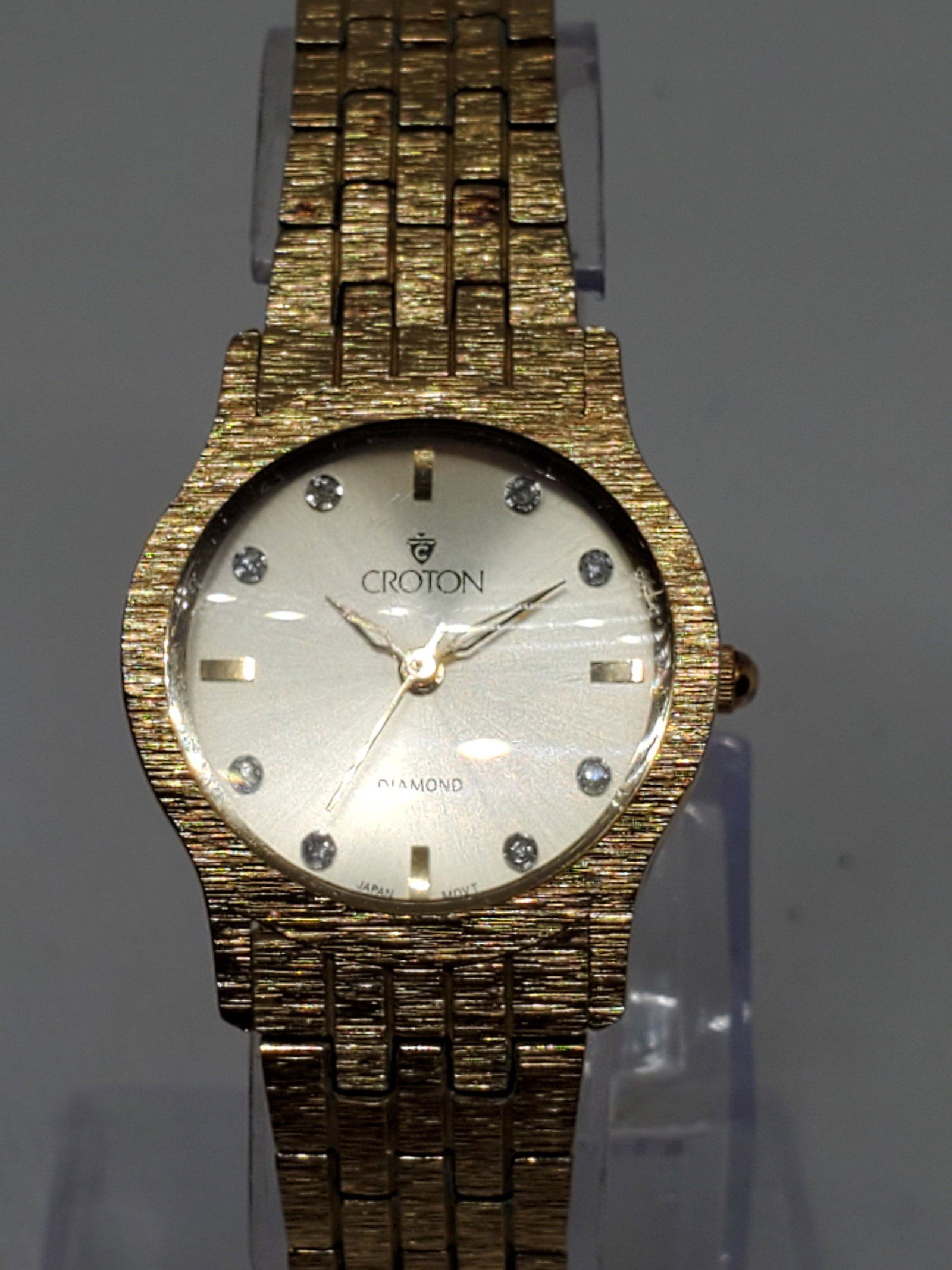 Croton Gold Plated Watch with Diamond Markers, 1990s, Working: Croton Diamond watch in operation, a true statement piece for those who appreciate luxury and precision. The gold plated case and gold tone dial, adorned with eight genuine diamond markers, create a s