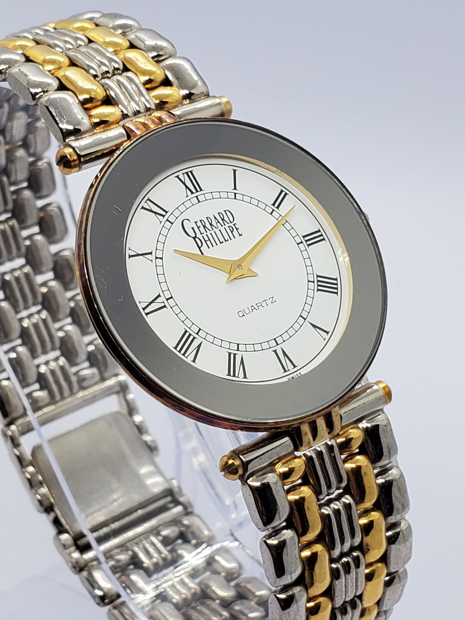 Gerrard Phillipe Gold Plated Roman Dial Quartz Dress Watch 31mm, 1990s, Working: This elegant Gerrard Phillipe quartz dress watch presents a refined classic look with a gold plated case, crystal style bezel, and a white dial accented by traditional Roman numerals for timeless soph