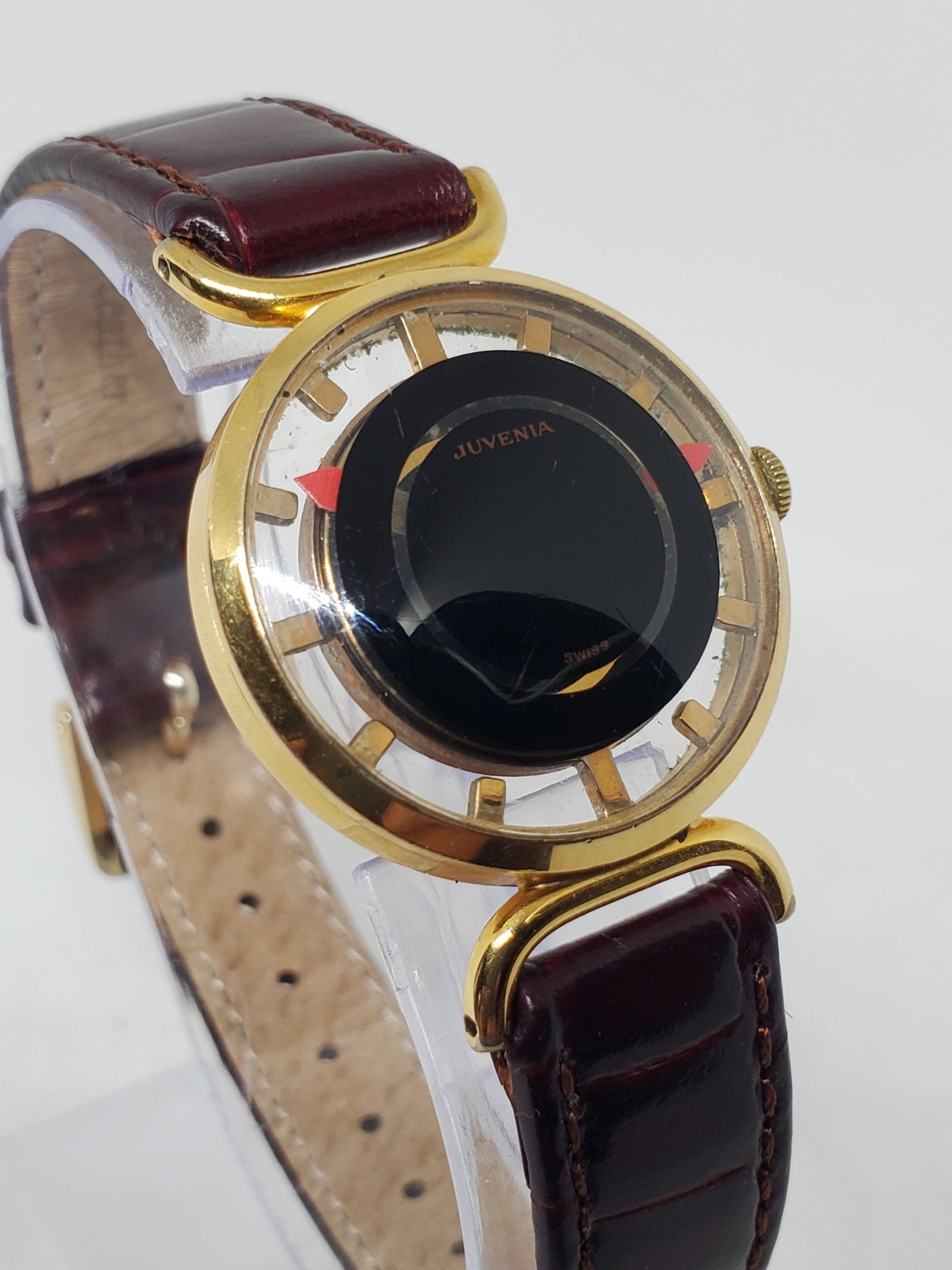 Juvenia Mystere Skeleton Manual Gold Plated Swiss Dress Watch 28mm, 1960s: This elegant Juvenia Mystere dress watch exemplifies refined Swiss watchmaking with a distinctive Mystere dial that creates a floating hand effect, paired with a tasteful skeleton back revealing the m