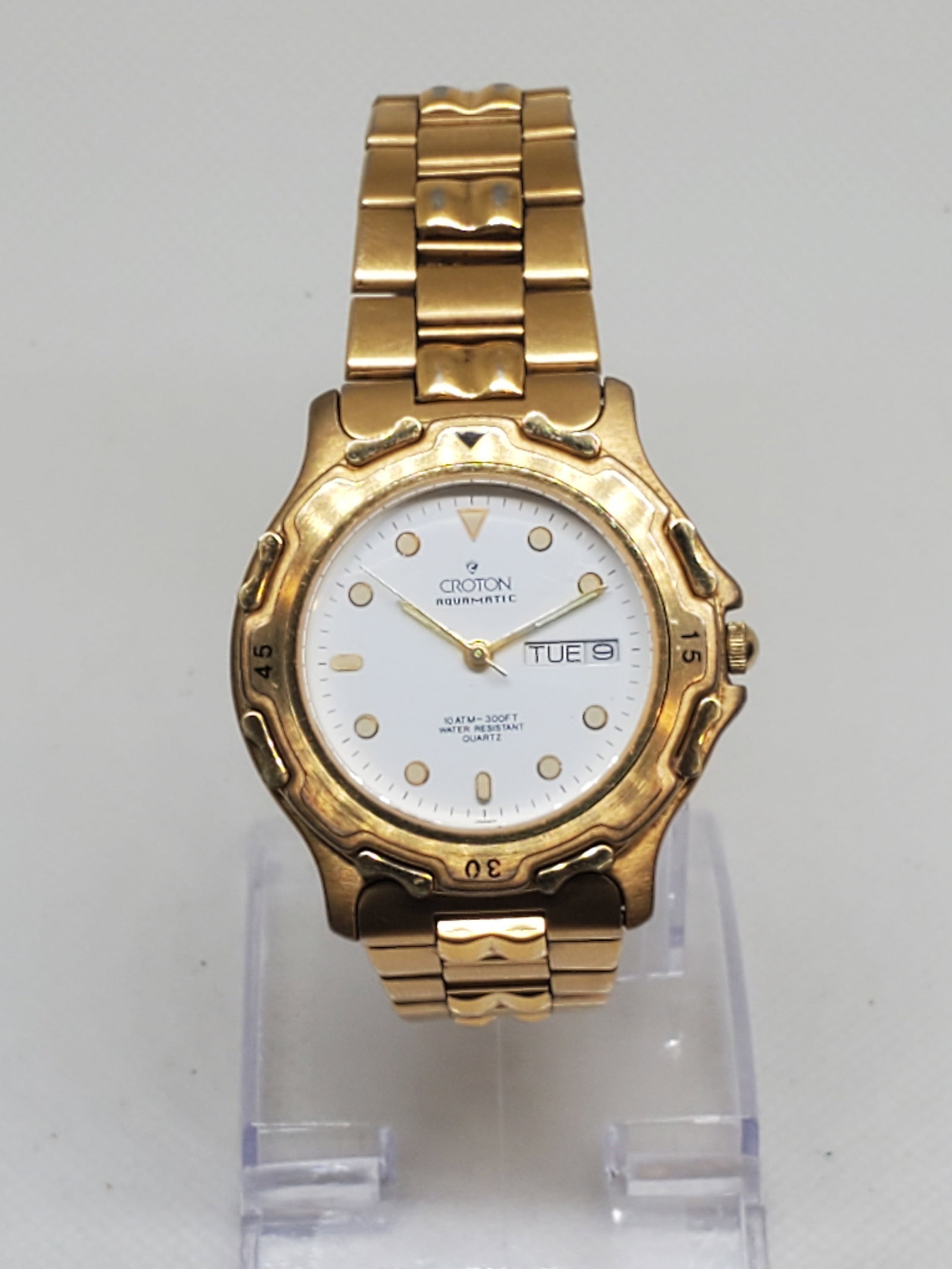 Croton Aquamatic Gold Plated Men's Watch, 1990s, Working: Discover reliable style with the Croton Aquamatic, a quartz powered timepiece that blends everyday utility with gold tone elegance running . Featuring a 36mm (1.4?) gold plated case, this watch showca