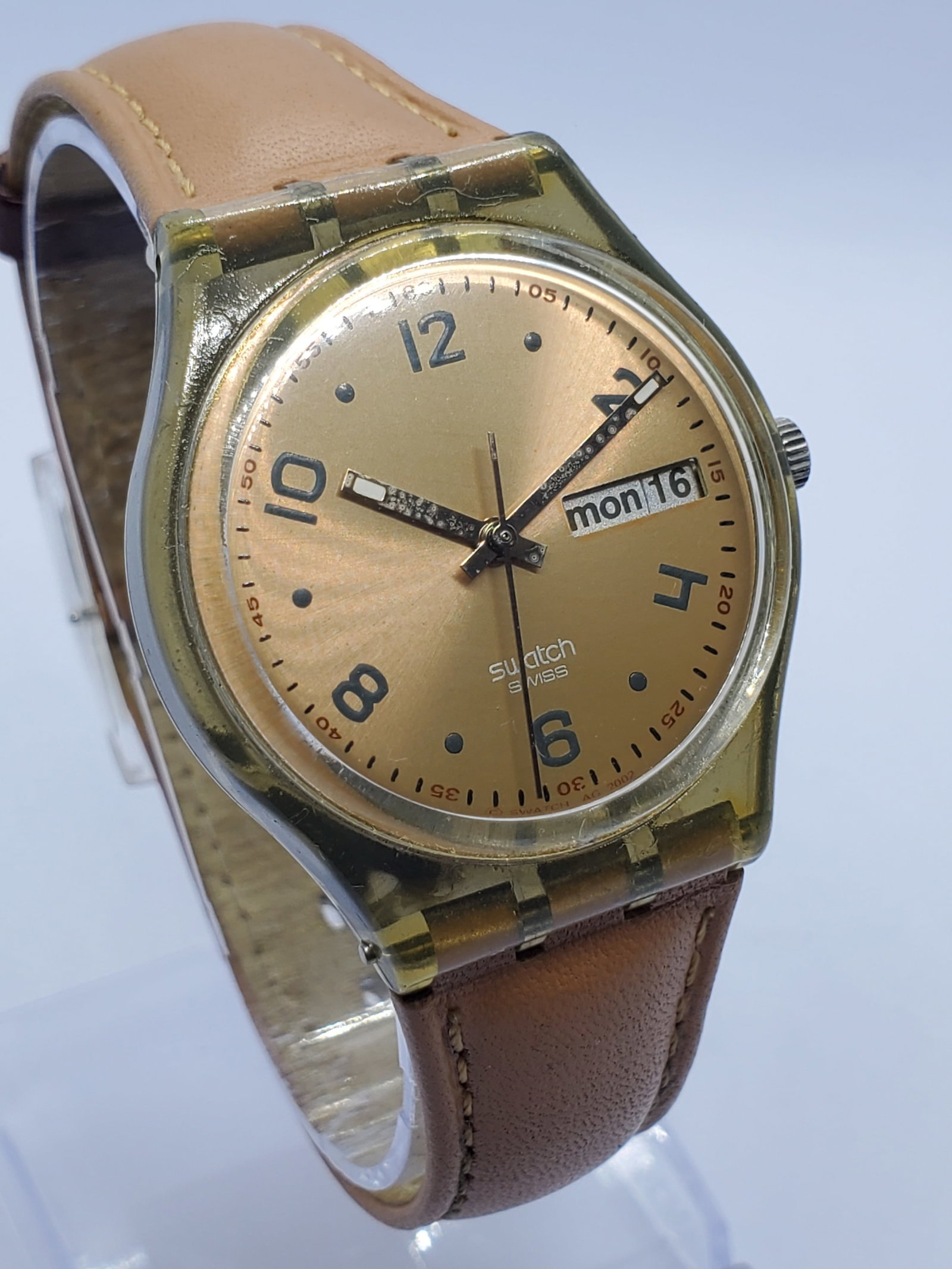 Swatch Gent 2002 Gold Dial Day Date 34mm Swiss Vintage Watch, 2002, Working: This Swatch Gent Quartz watch showcases the bold creativity that made Swatch a global icon of accessible Swiss design. Founded in 1983 in Biel Switzerland by Nicolas Hayek through SMH, now the Swatch 