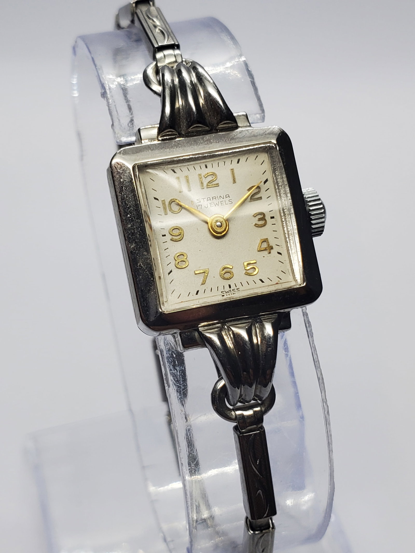 Vintage Starina 17 Jewels Swiss Manual Wind Ladies Dress Watch, 18mm, 1950s, Running: Elegant and timeless, this vintage Starina 17 Jewels Swiss manual wind ladies dress watch reflects the refined craftsmanship that made mid century Swiss watches highly desirable. Although Starina was 
