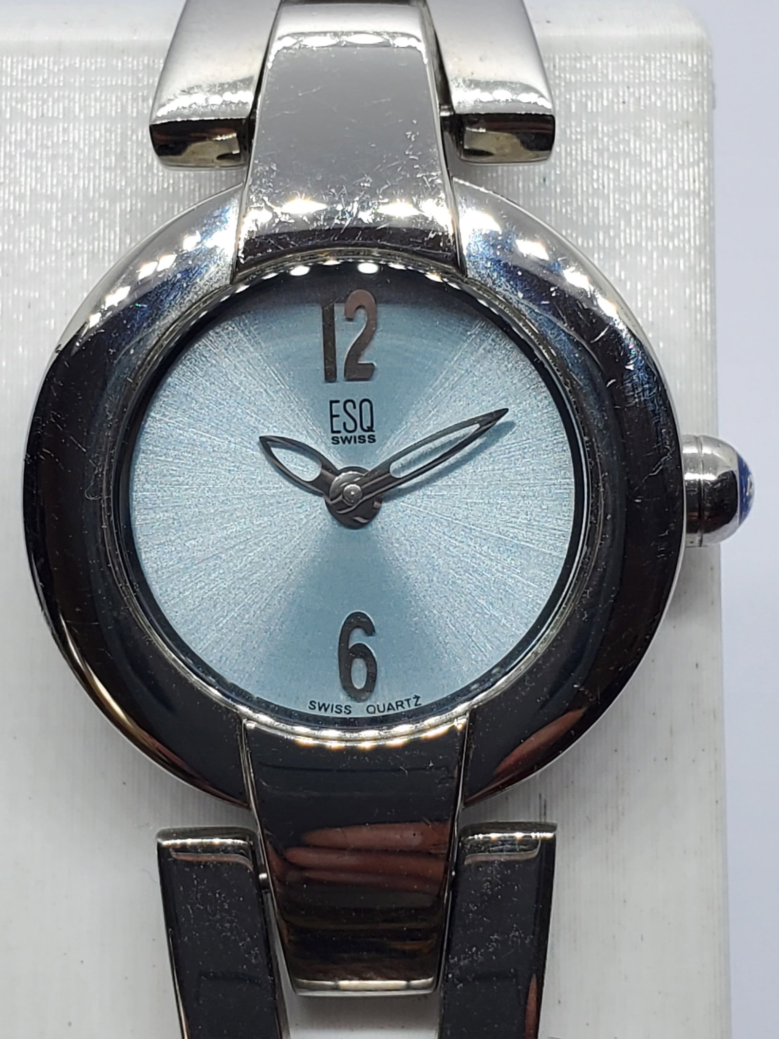 Vintage Movado ESQ E5304 Swiss Quartz Dress Watch Aqua Dial 23mm, 1990s, Running: This vintage Movado ESQ E5304 Swiss quartz dress watch presents a refined blend of elegance and modern Swiss design, making it an ideal choice for understated luxury and everyday sophistication. The c