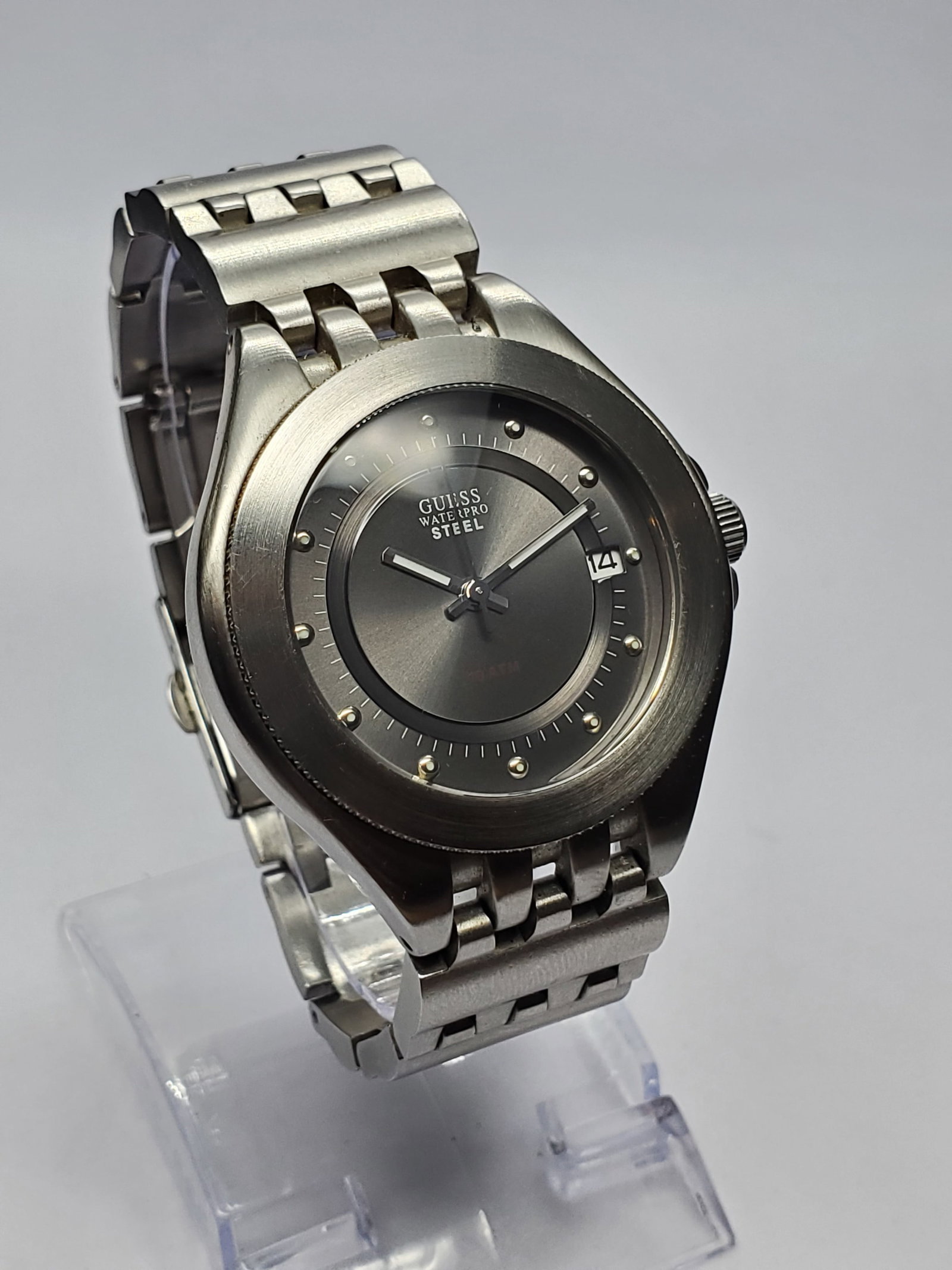 Vintage Guess Waterpro Steel 10 ATM Sport Watch, 39mm, 2000s, Running: Guess, founded in 1981 in Los Angeles by the Marciano brothers, became an iconic American fashion brand known for bold contemporary styling and trend driven accessories. This Guess Waterpro Steel G900